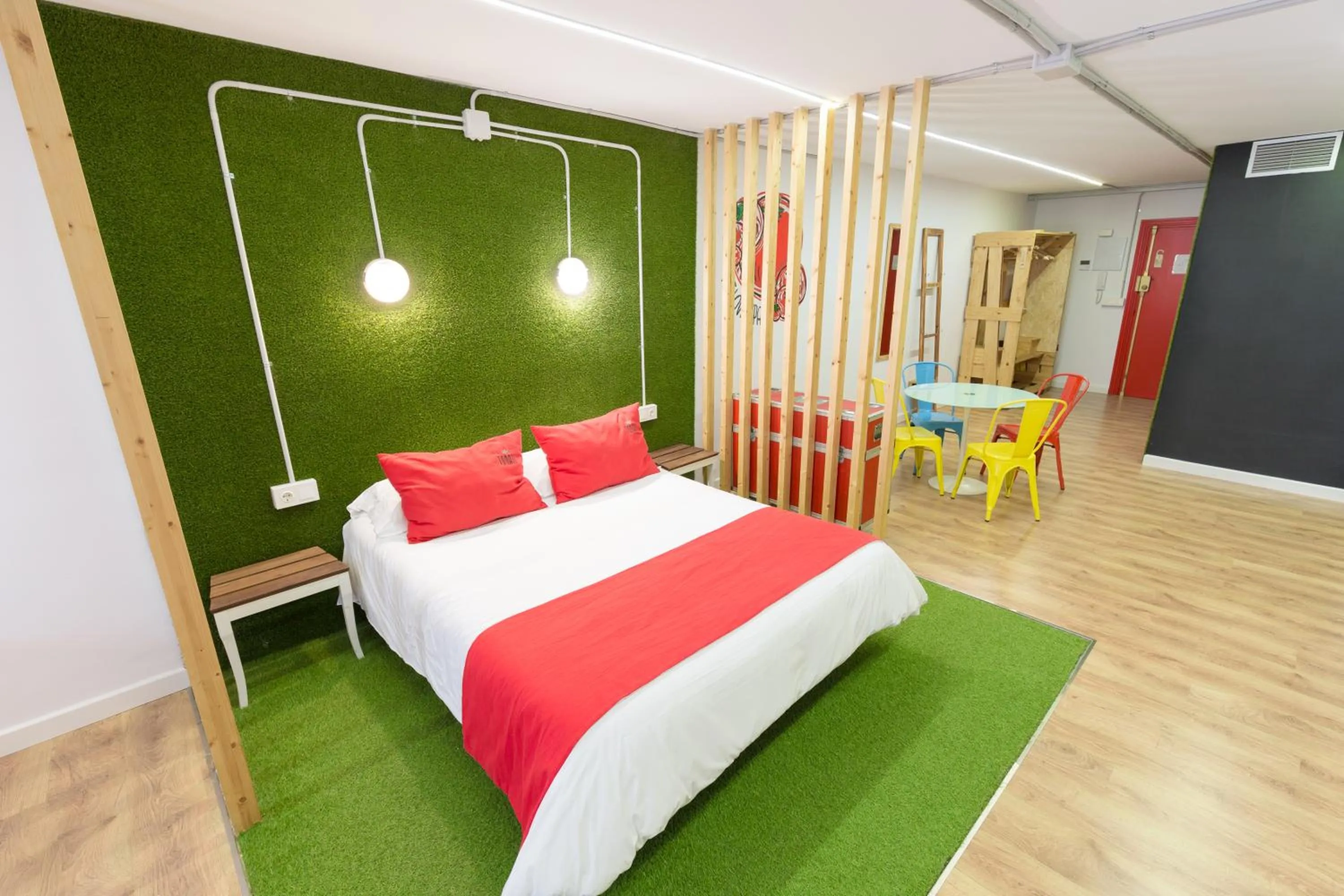 Bed in Tomate Rooms