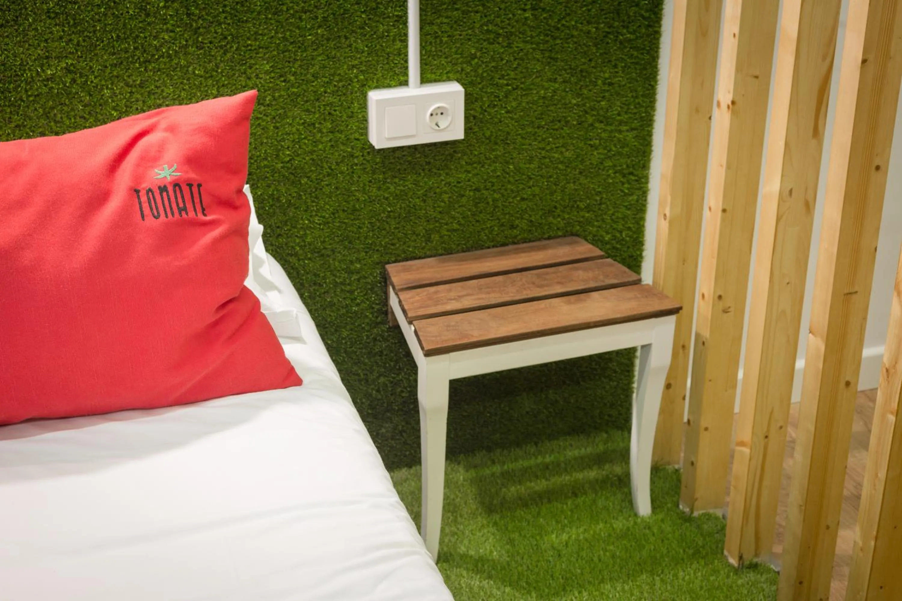Bed in Tomate Rooms