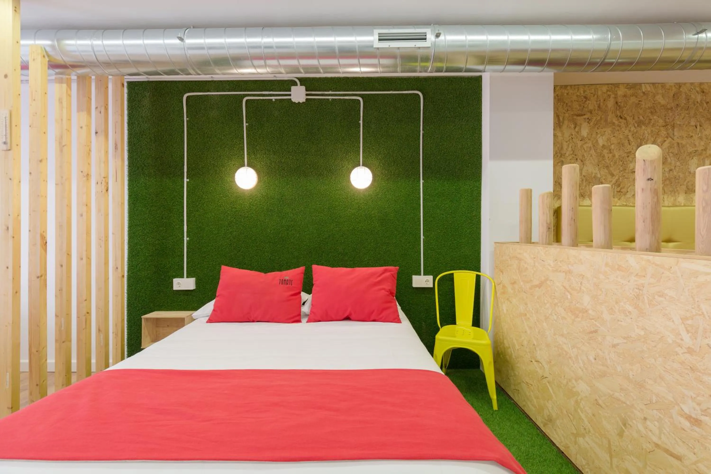Bed in Tomate Rooms