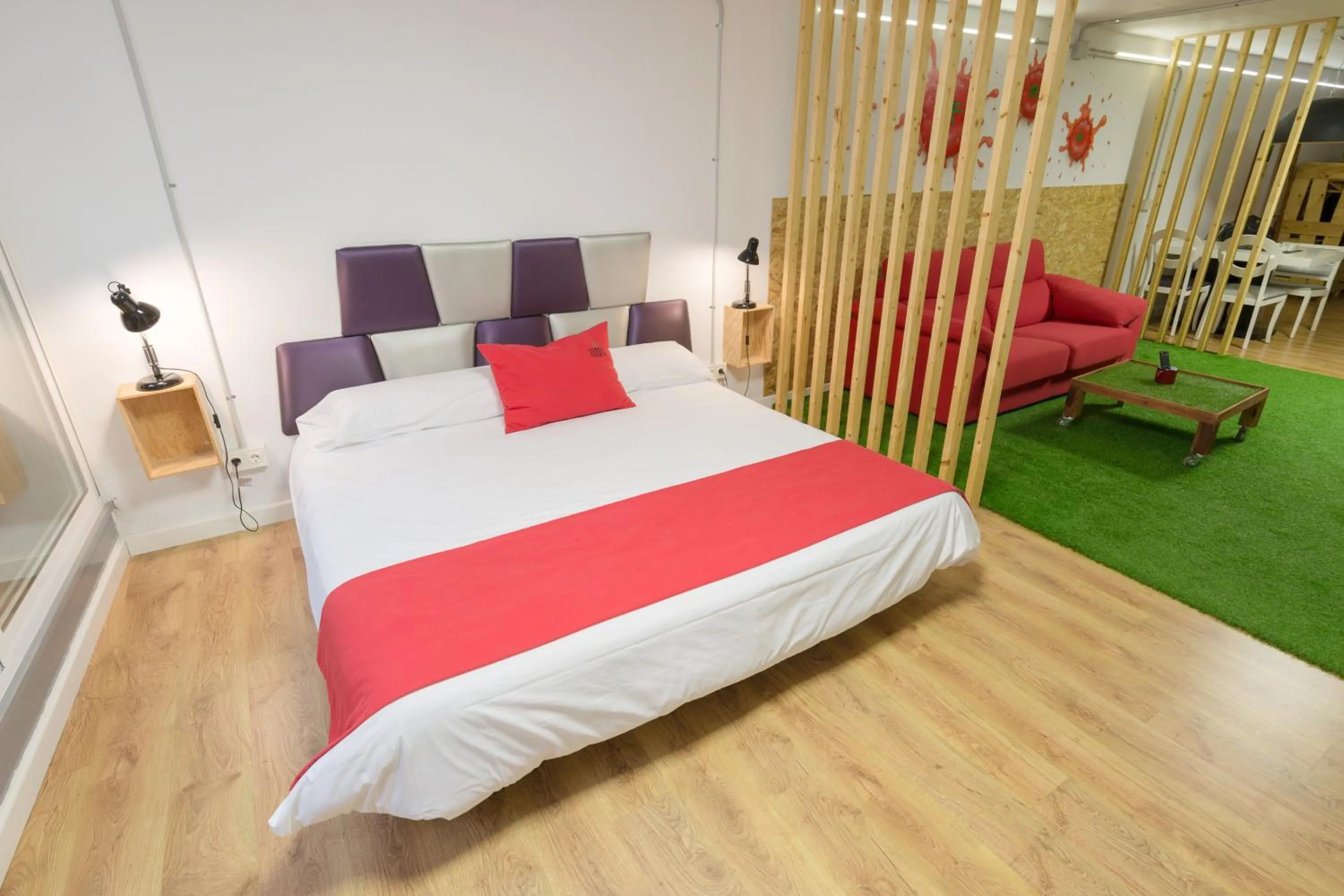 Bed in Tomate Rooms