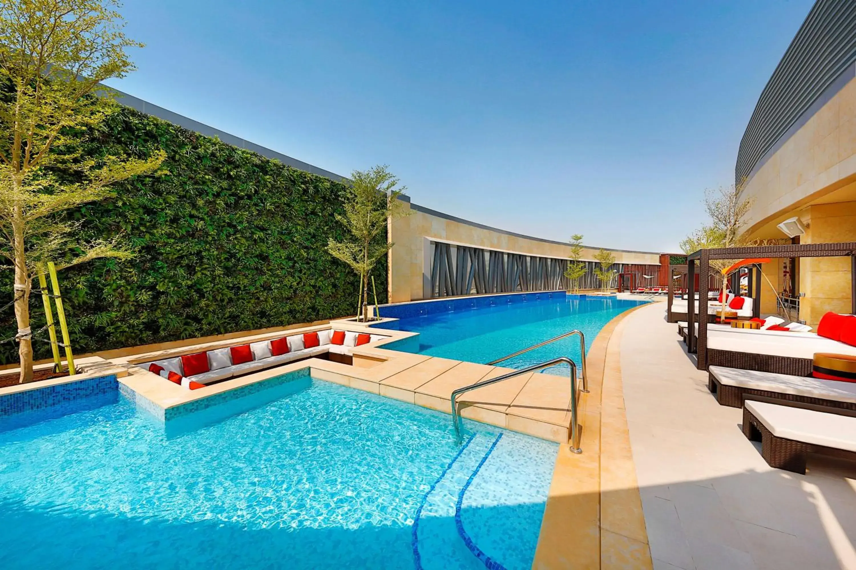 Pool view in AlRayyan Hotel Doha, Curio Collection by Hilton Pool view in AlRayyan Hotel Doha, Curio Collection by Hilton