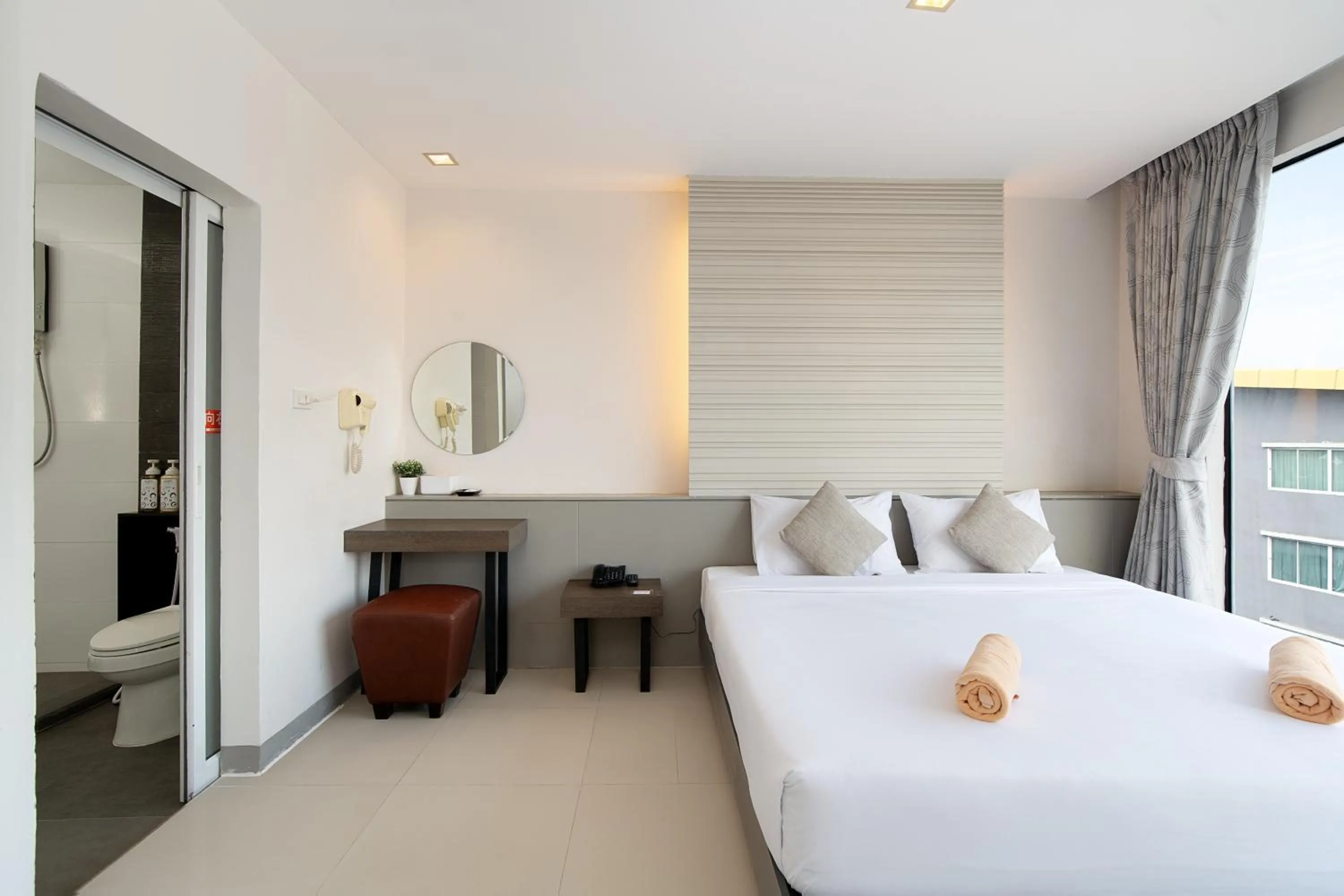 Bed in Leenova Hotel