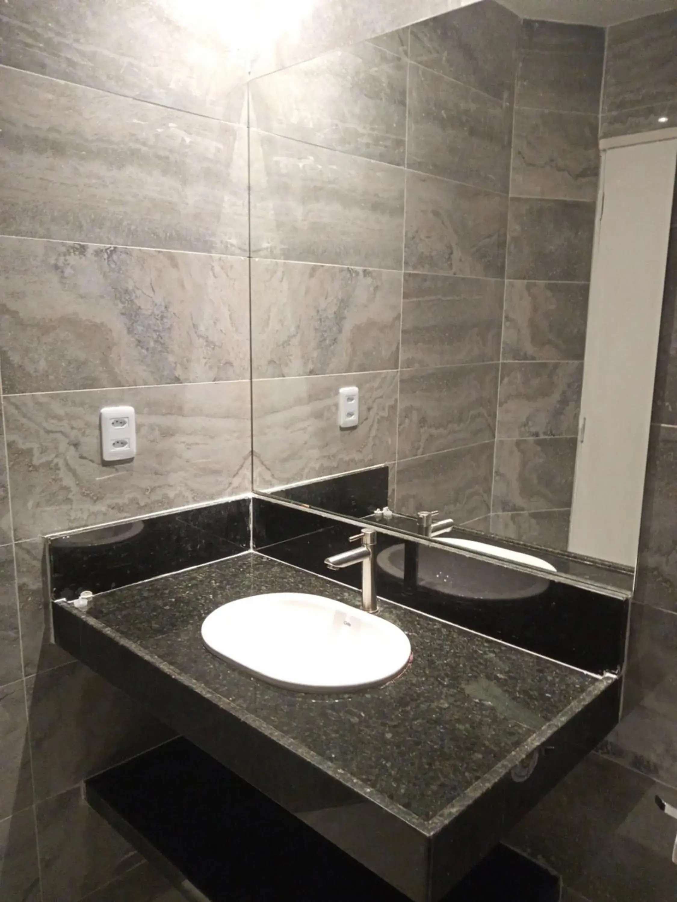 Bathroom in La Suite Praia Hotel Bathroom in La Suite Praia Hotel