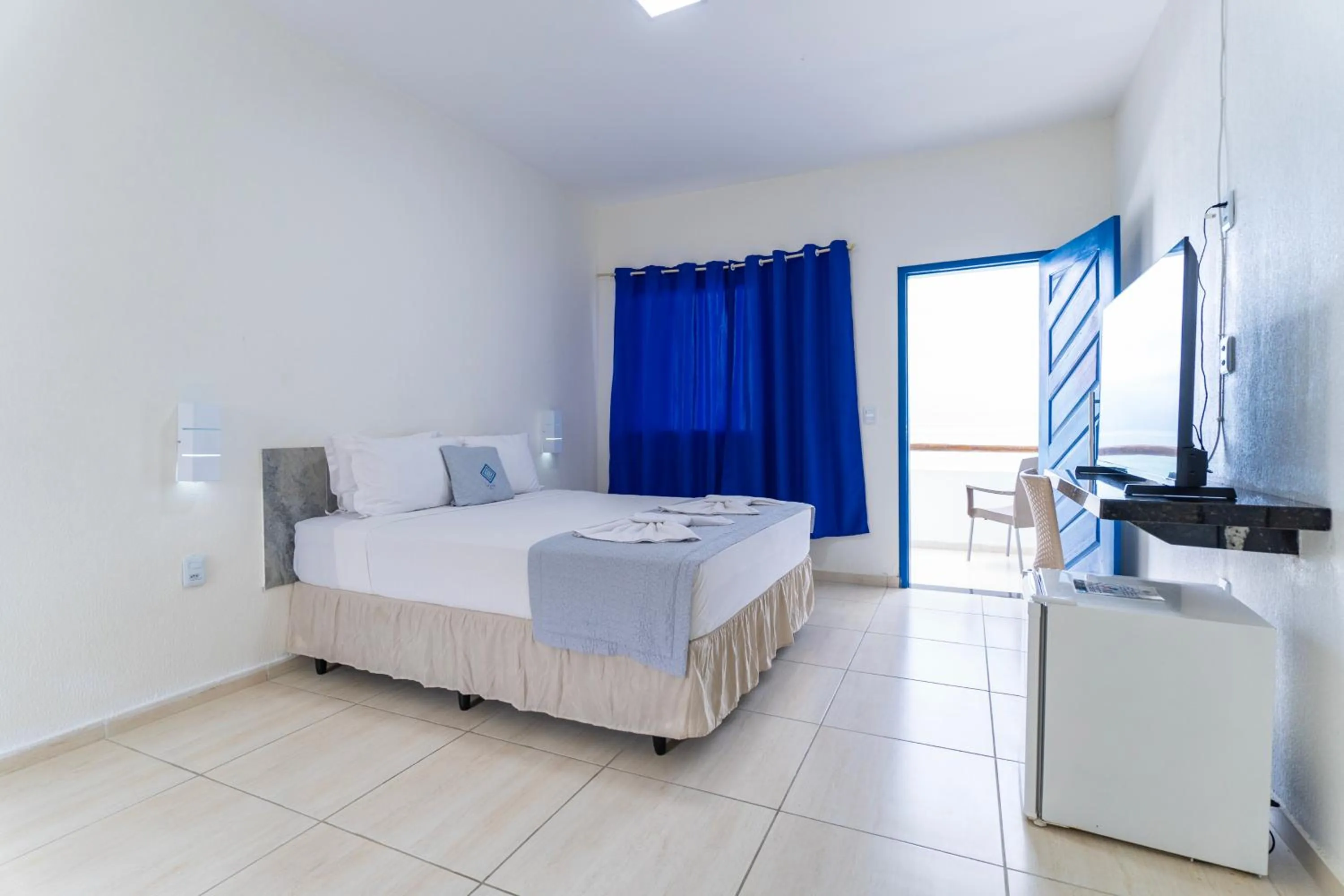 Bed in La Suite Praia Hotel