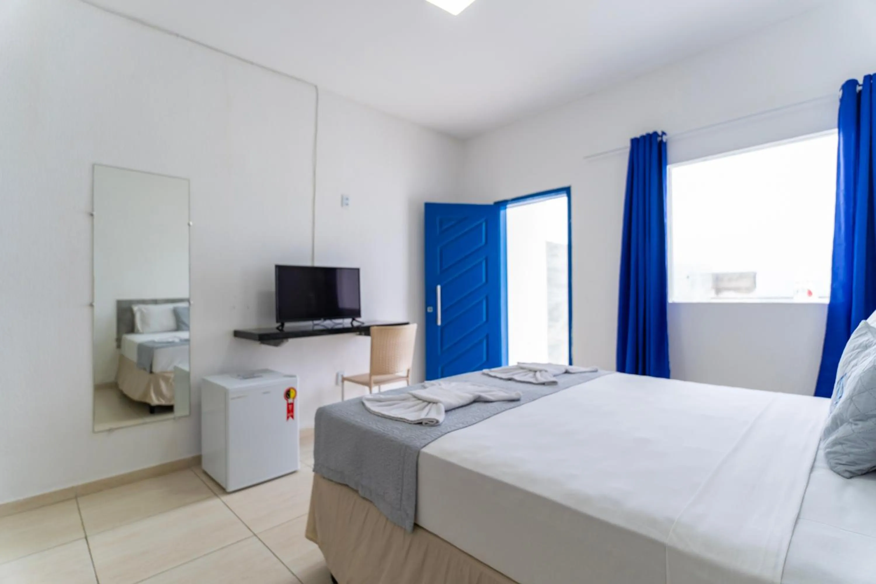 Bed in La Suite Praia Hotel