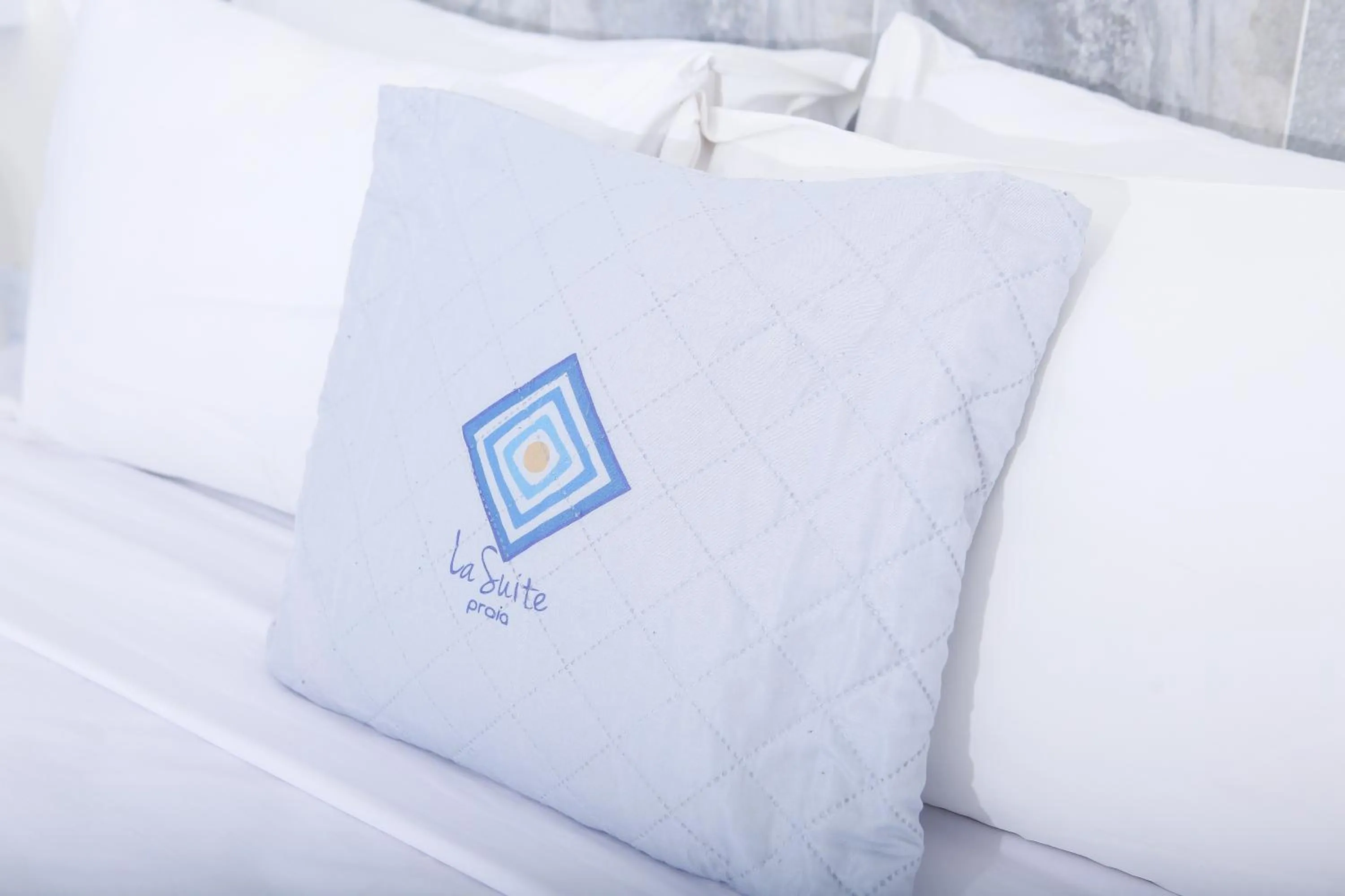 Bed in La Suite Praia Hotel