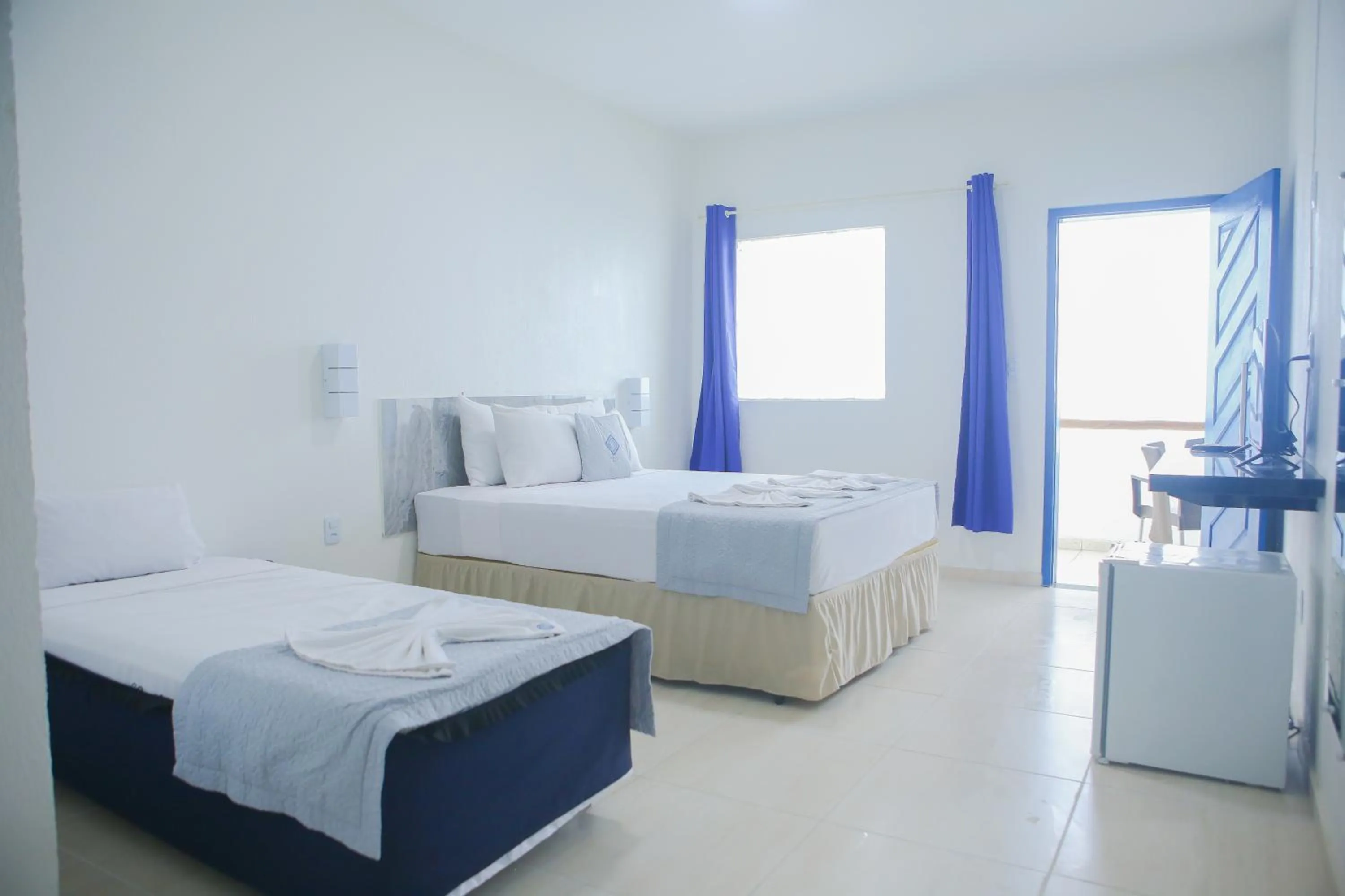 Photo of the whole room, Bed in La Suite Praia Hotel