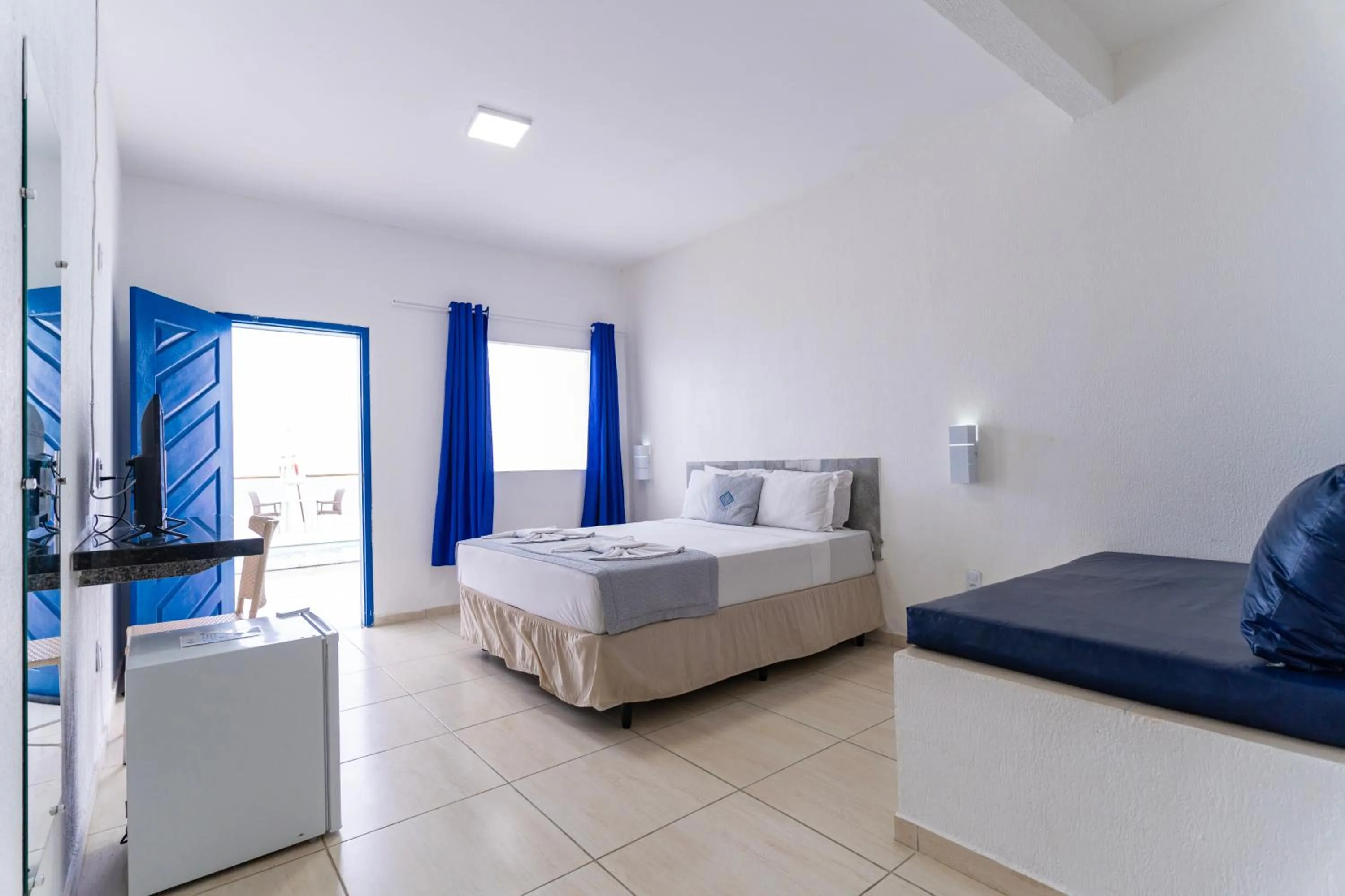 Bed in La Suite Praia Hotel