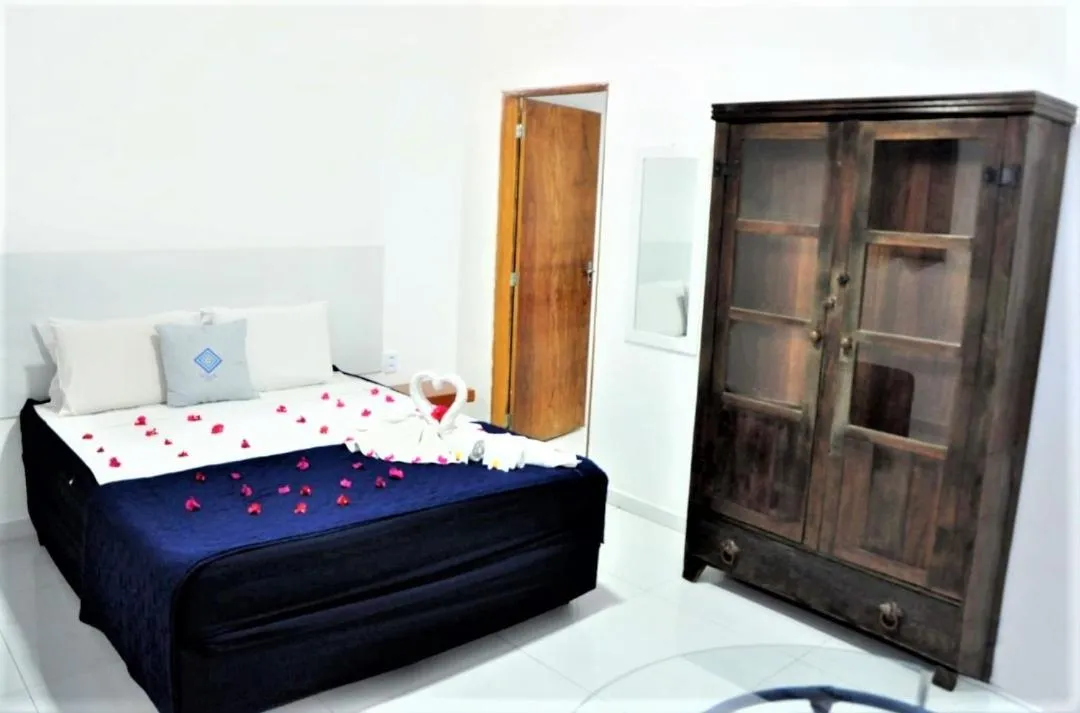 Bed in La Suite Praia Hotel