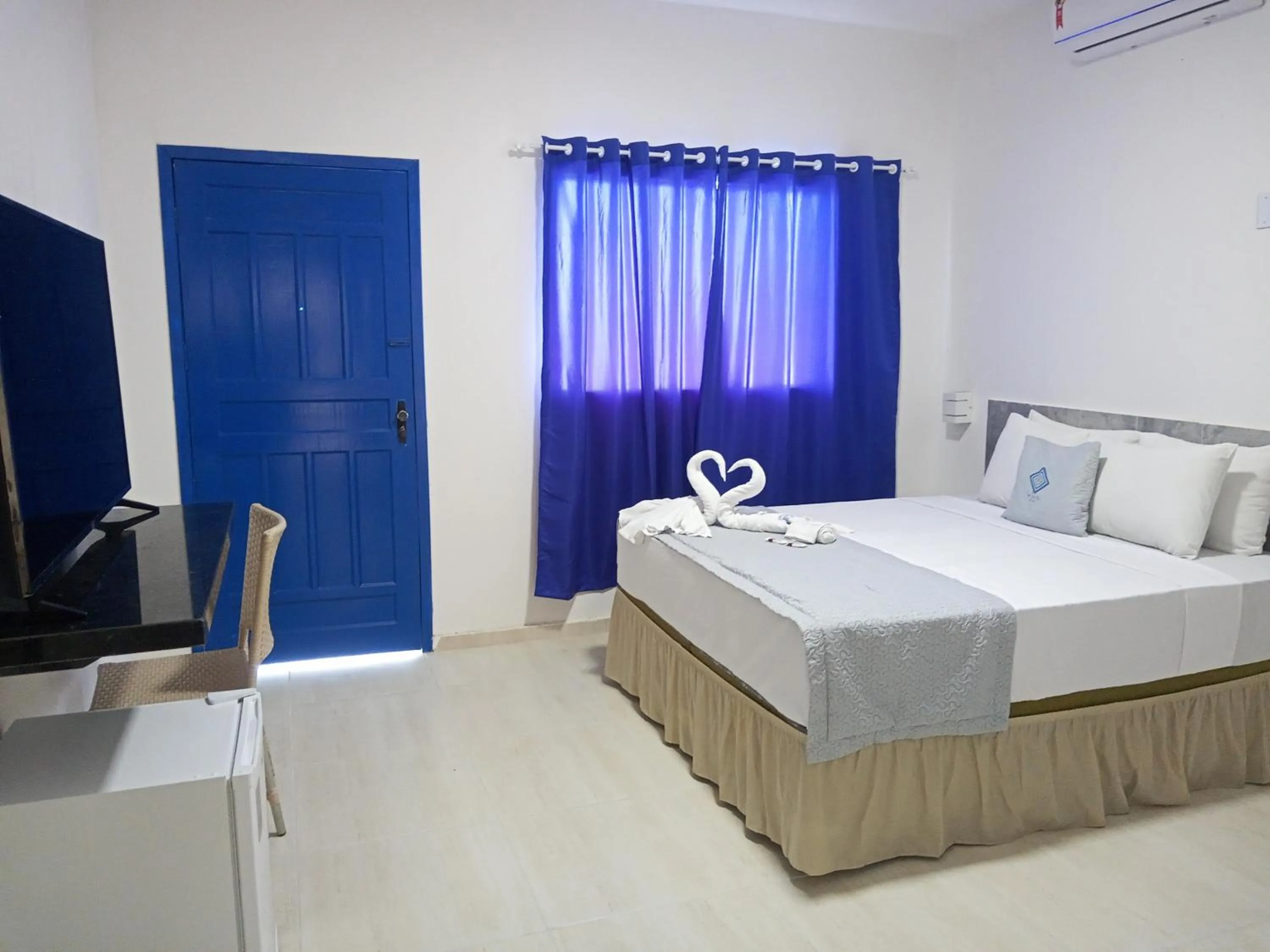 Photo of the whole room, Bed in La Suite Praia Hotel