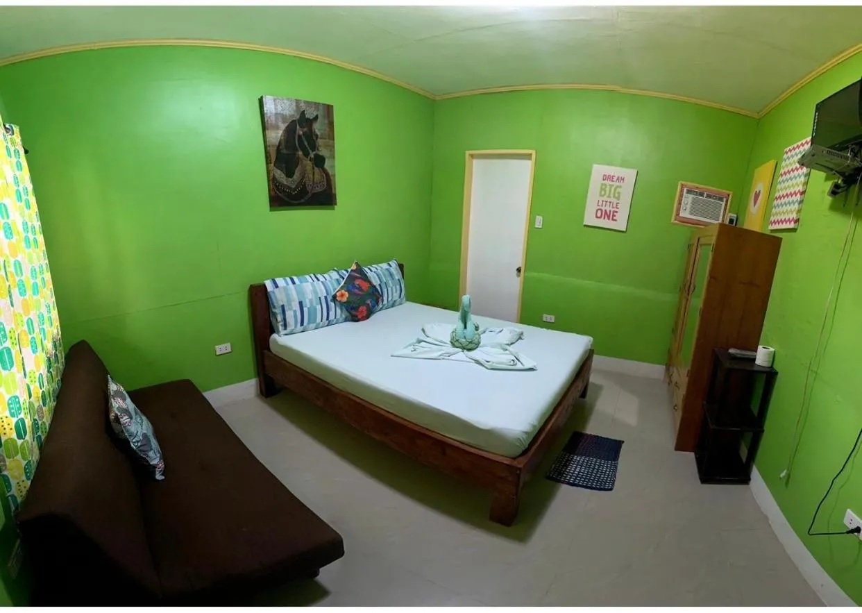 Bed in Domos Native Guest House