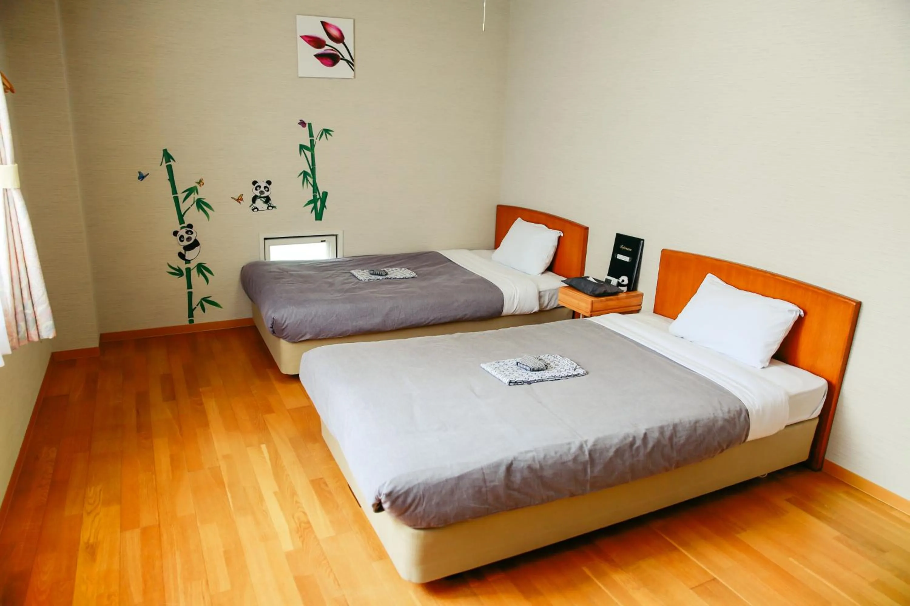 Bed in Shinnishiki Hotel