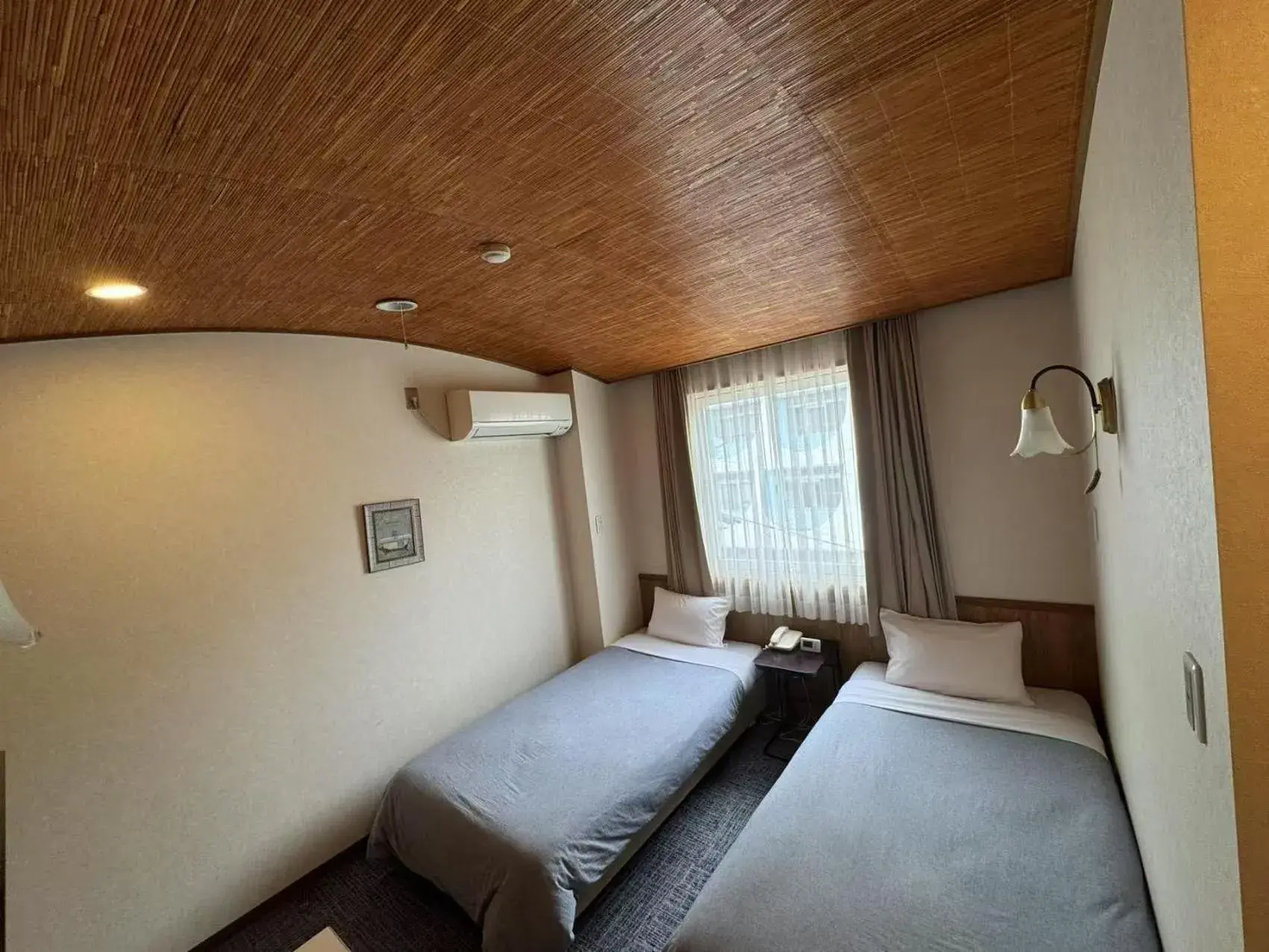 Bed in Shinnishiki Hotel Bed in Shinnishiki Hotel