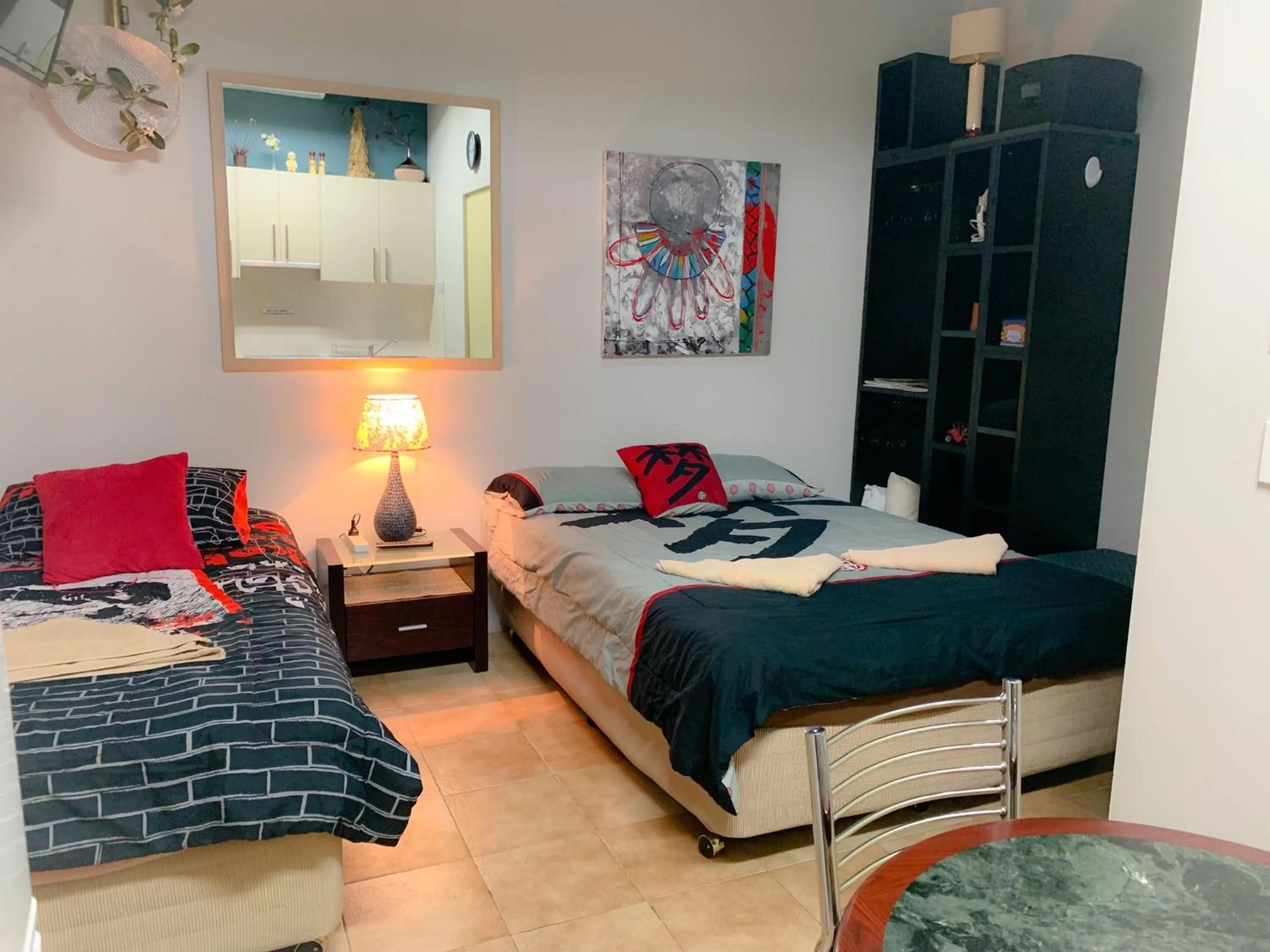 Bed in Westside Studio Apartments