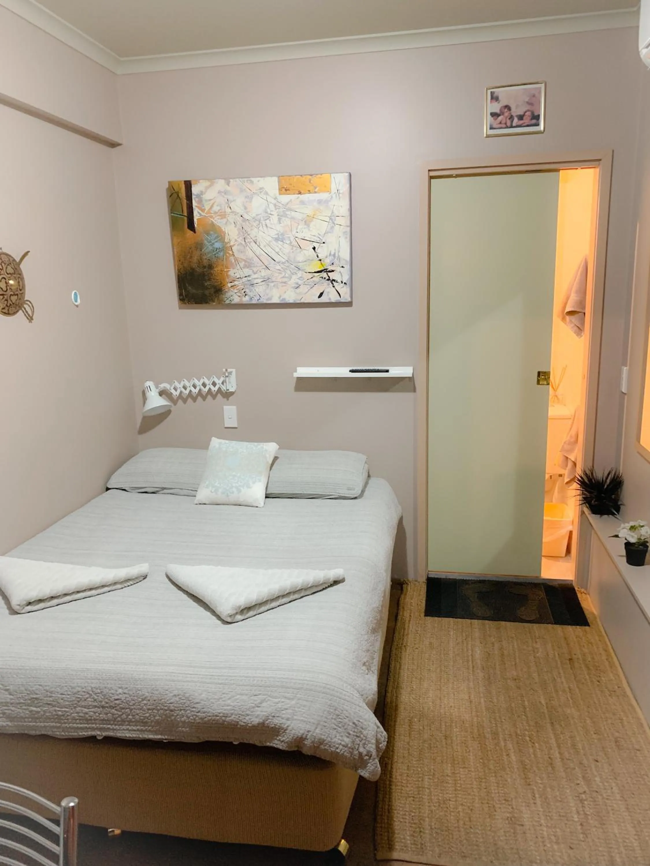 Bed in Westside Studio Apartments