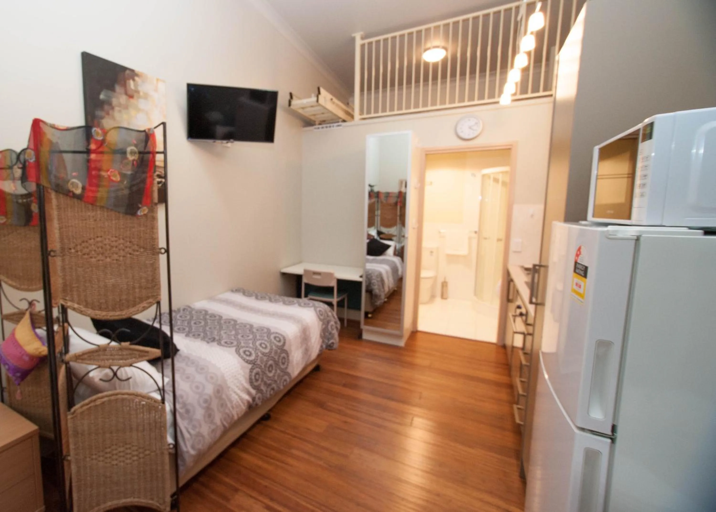 Bed in Westside Studio Apartments