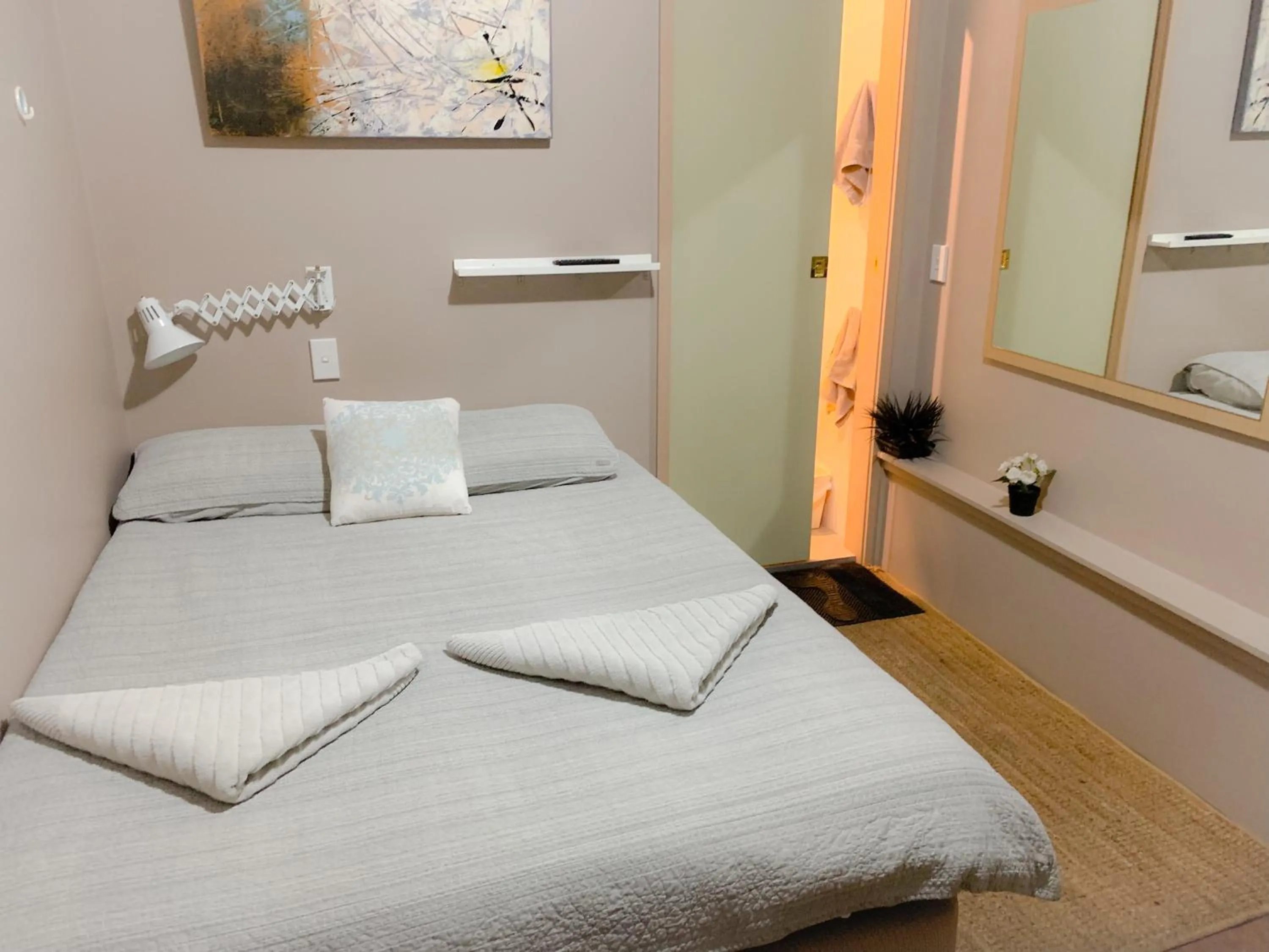 Bed in Westside Studio Apartments