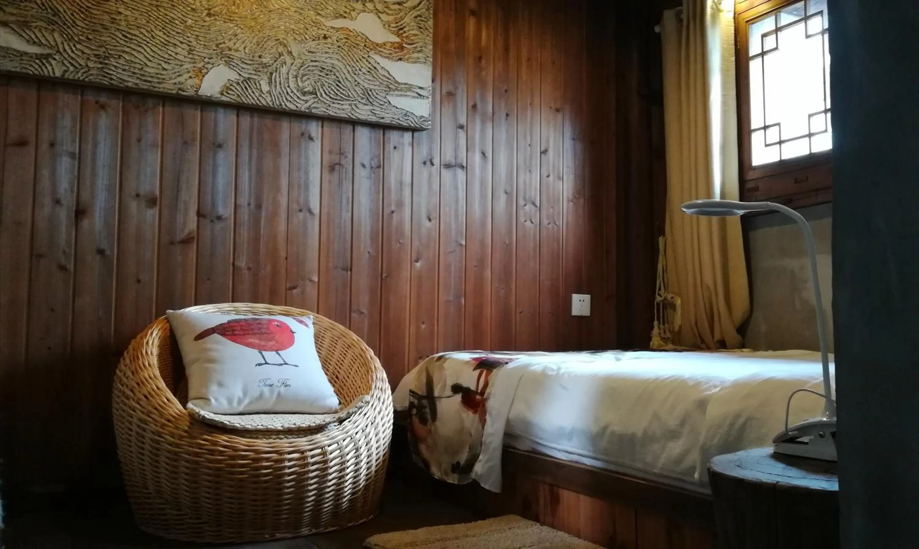 Bed in WuYuan QiYe YanXiang Guesthouse