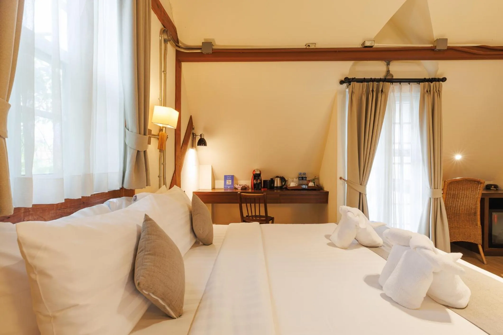 Bed in Le Charcoa Hotel