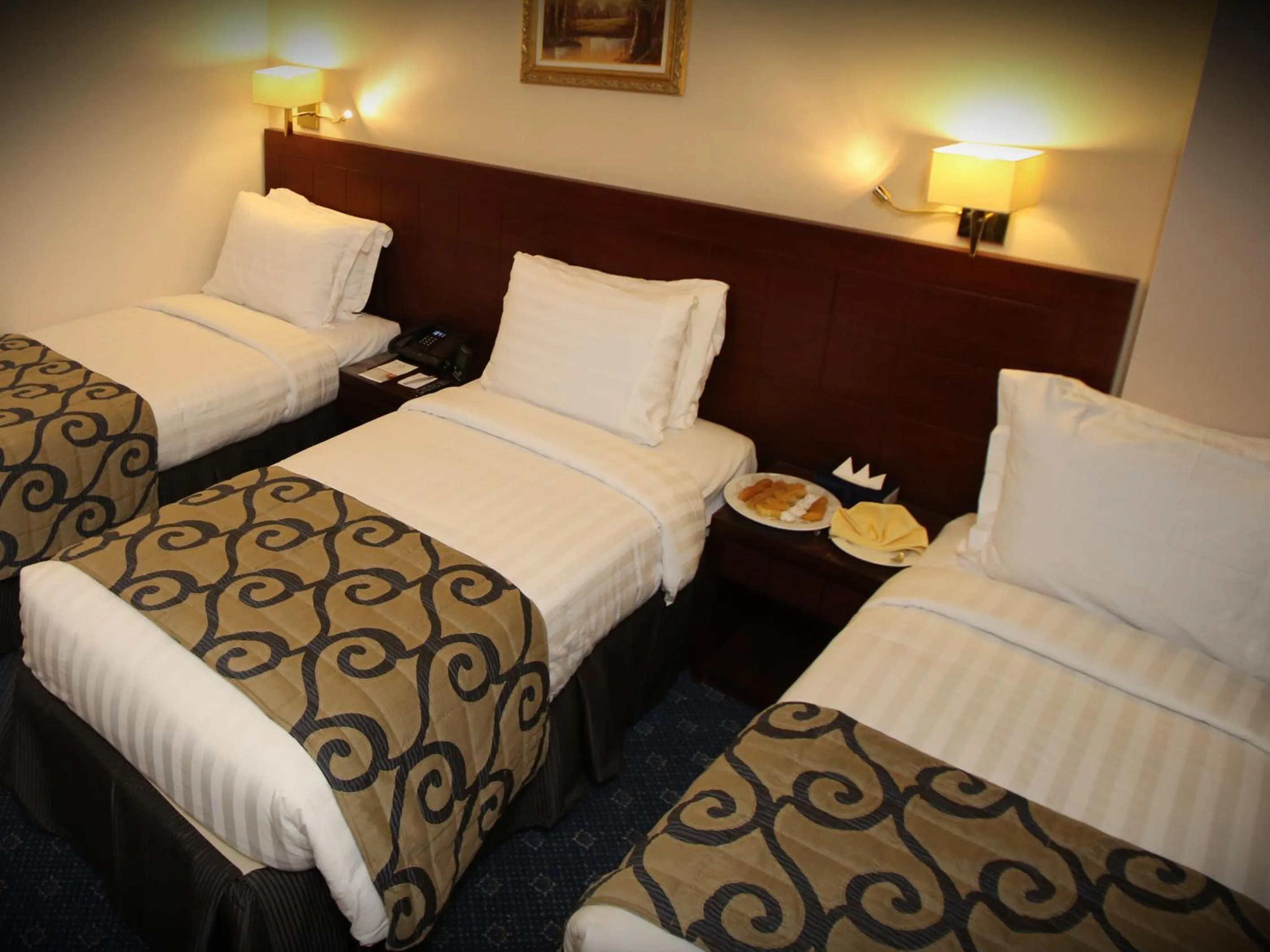 Bed in Al Aqeeq Al Rawda Hotel by Abu Al Joud