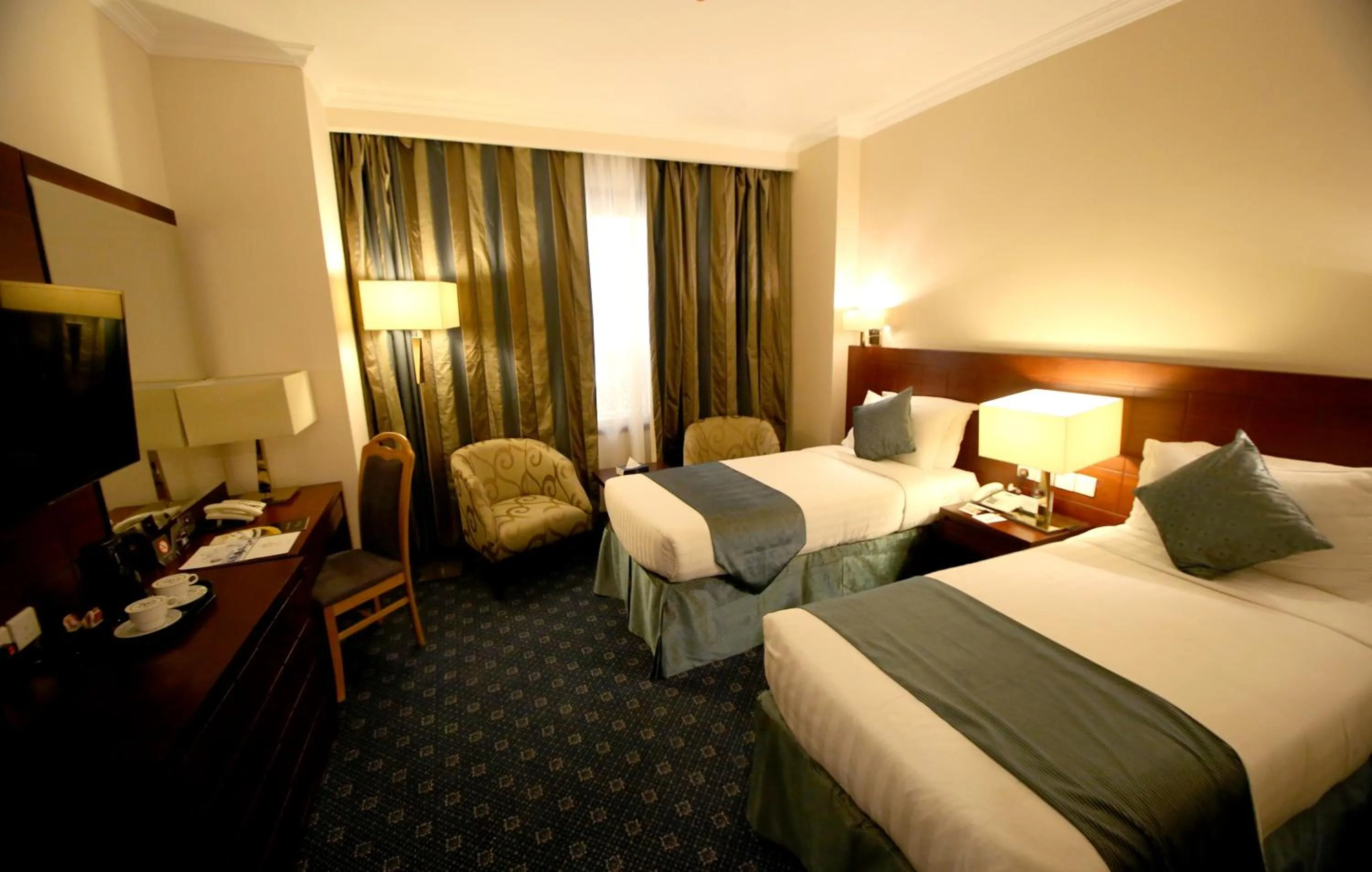 Bed in Al Aqeeq Al Rawda Hotel by Abu Al Joud