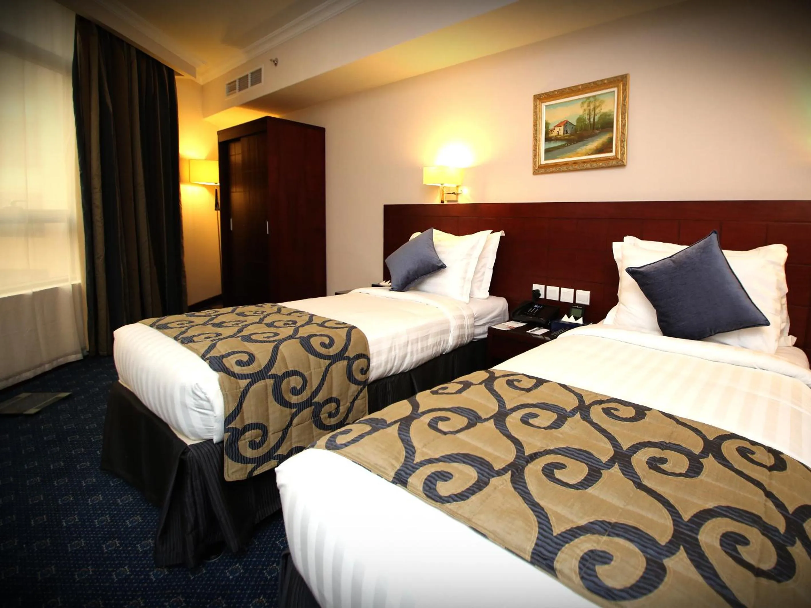 Bed in Al Aqeeq Al Rawda Hotel by Abu Al Joud