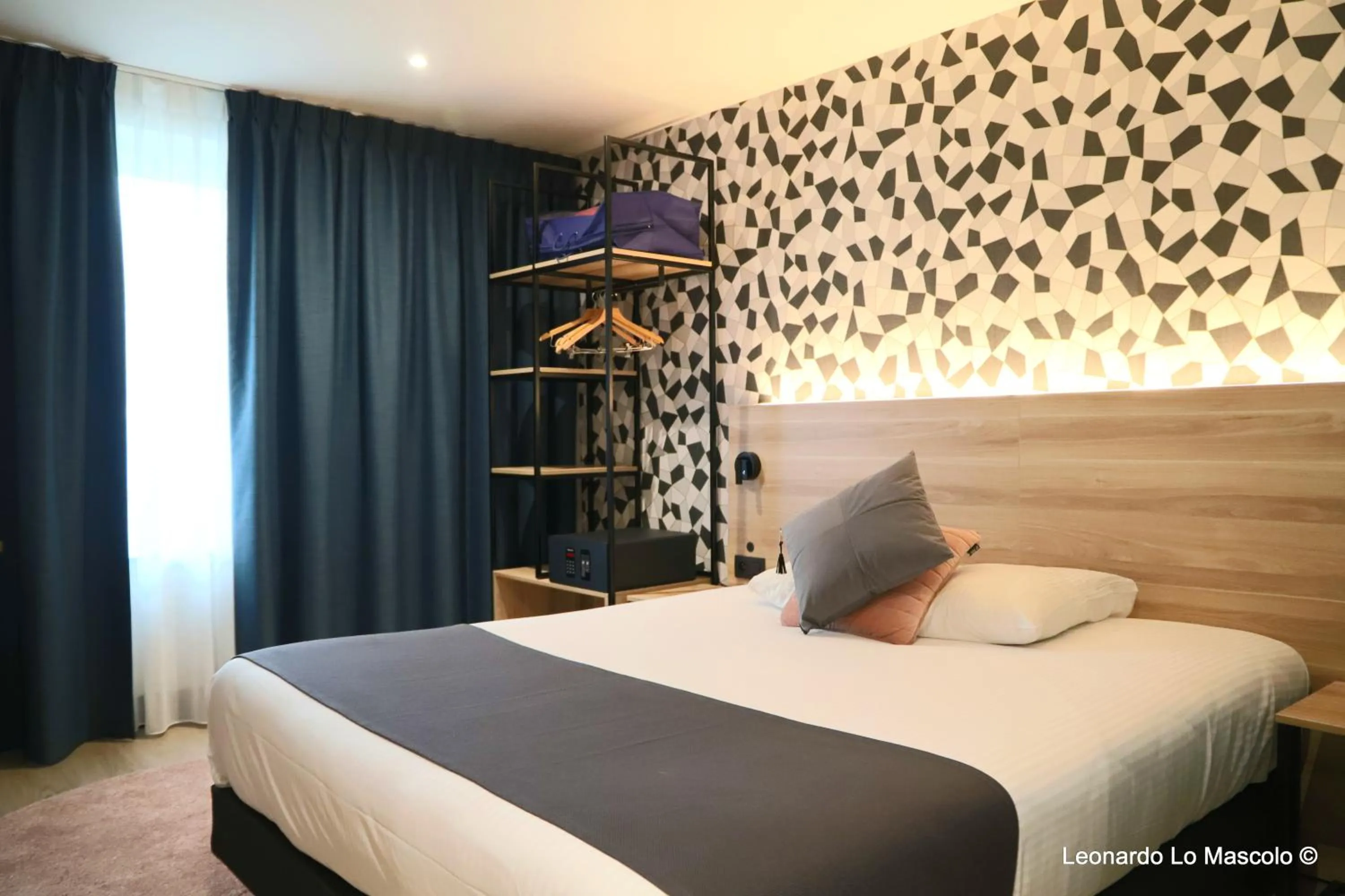 Bed in Hôtel de l'Univers Liège