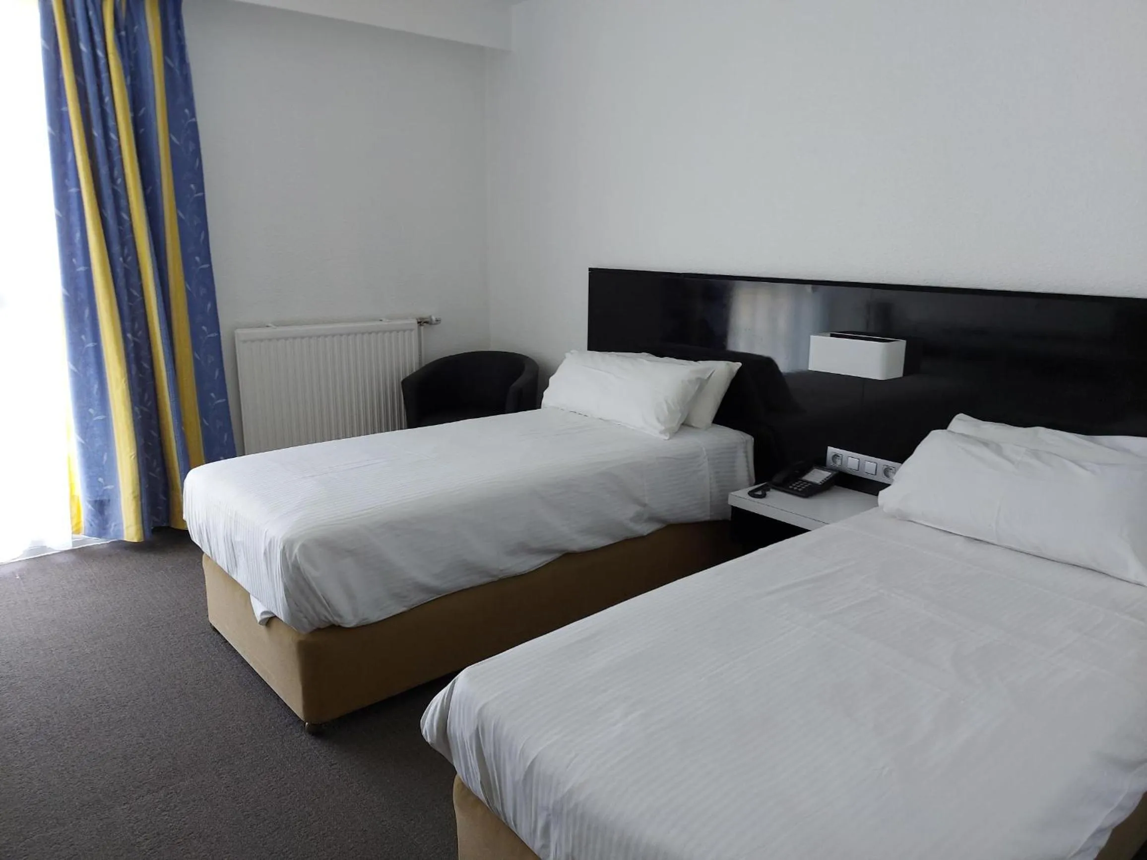 Bed in Globales Post Hotel & Wellness