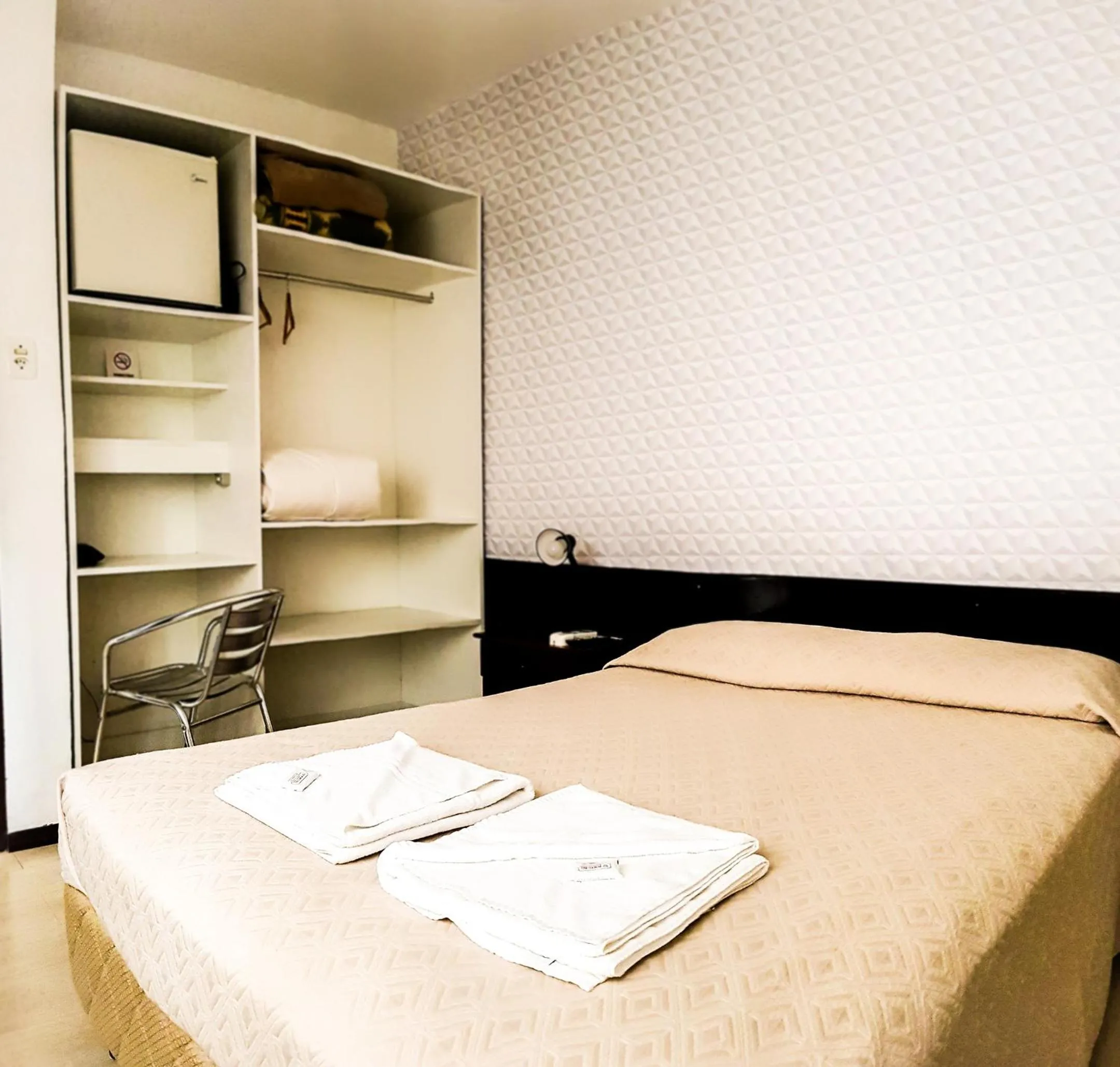 Bed in Porto Rei Residence Hotel