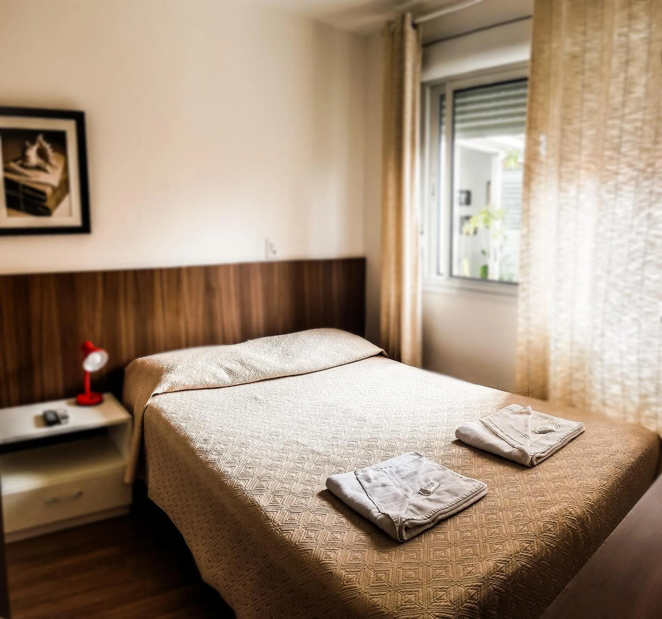 Bed in Porto Rei Residence Hotel