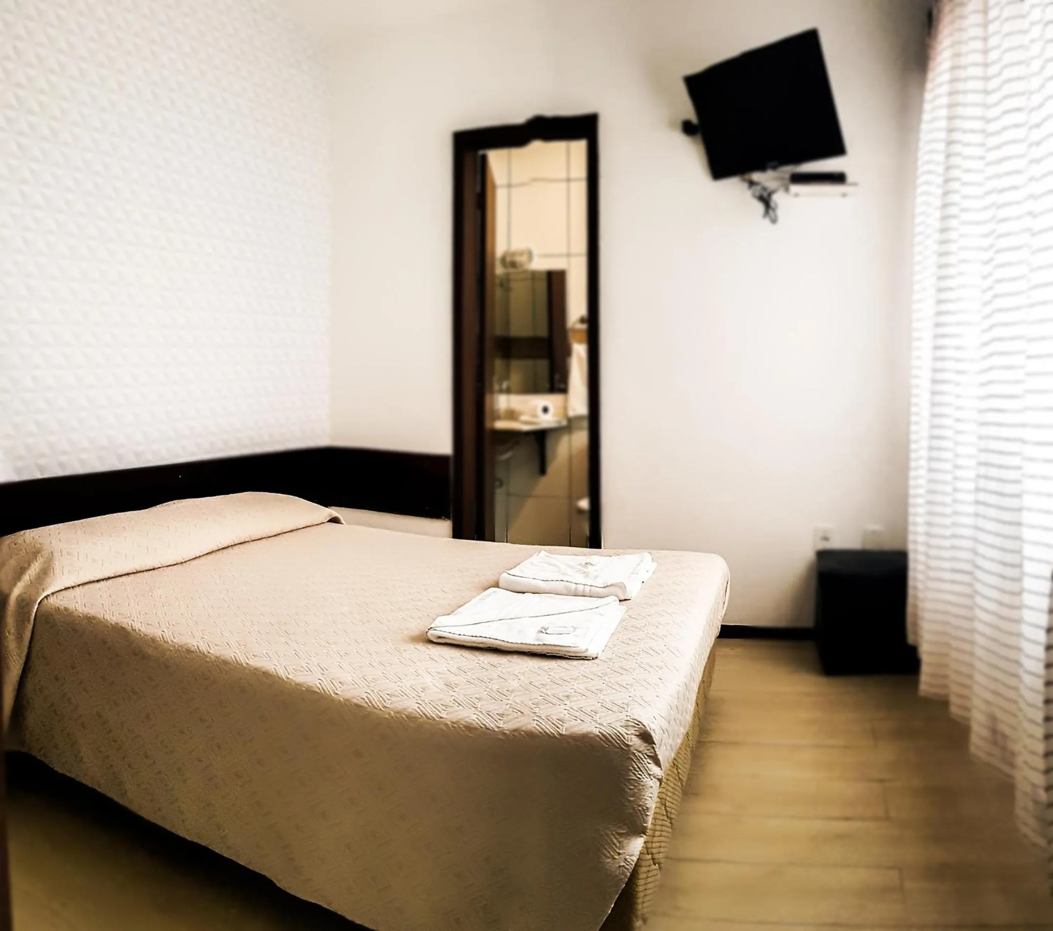 Bed in Porto Rei Residence Hotel