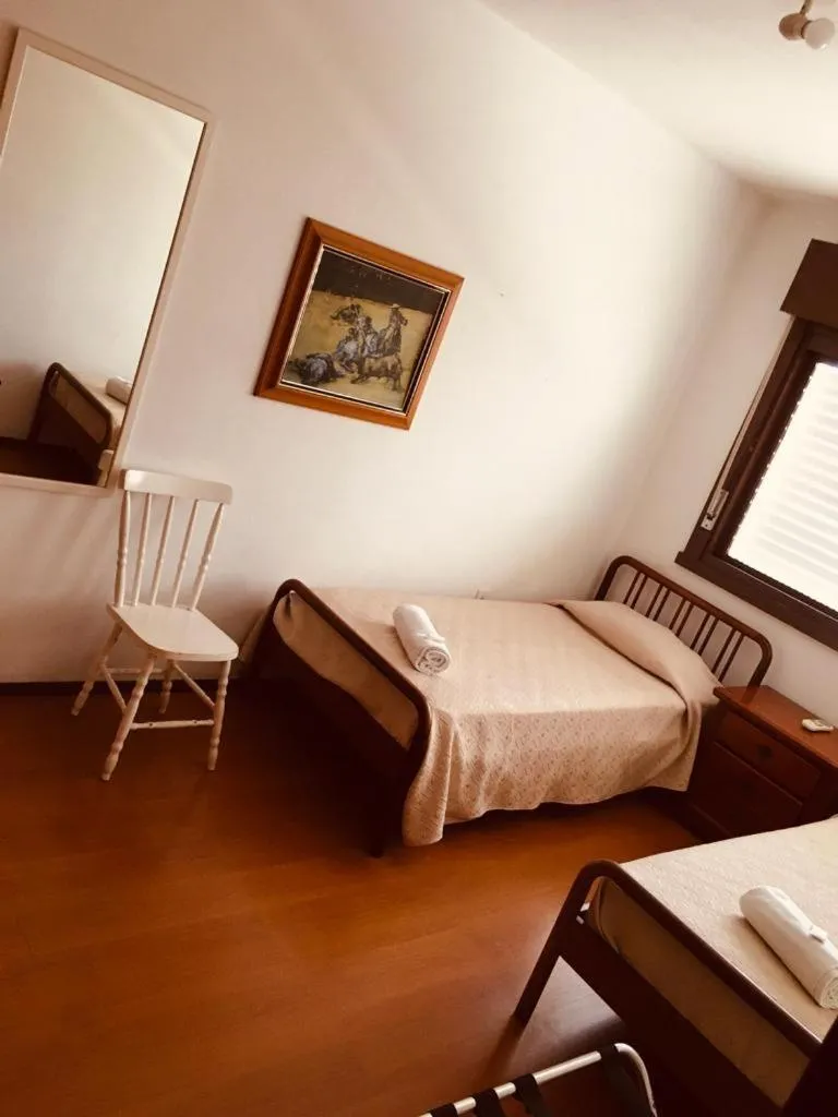 Bed in Porto Rei Residence Hotel
