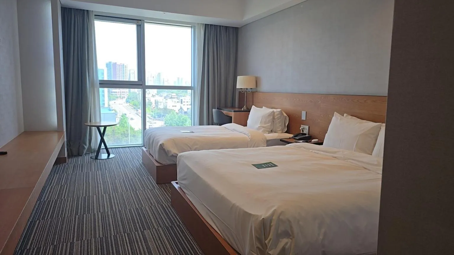 Bed in Golden Tulip Incheon Airport Hotel