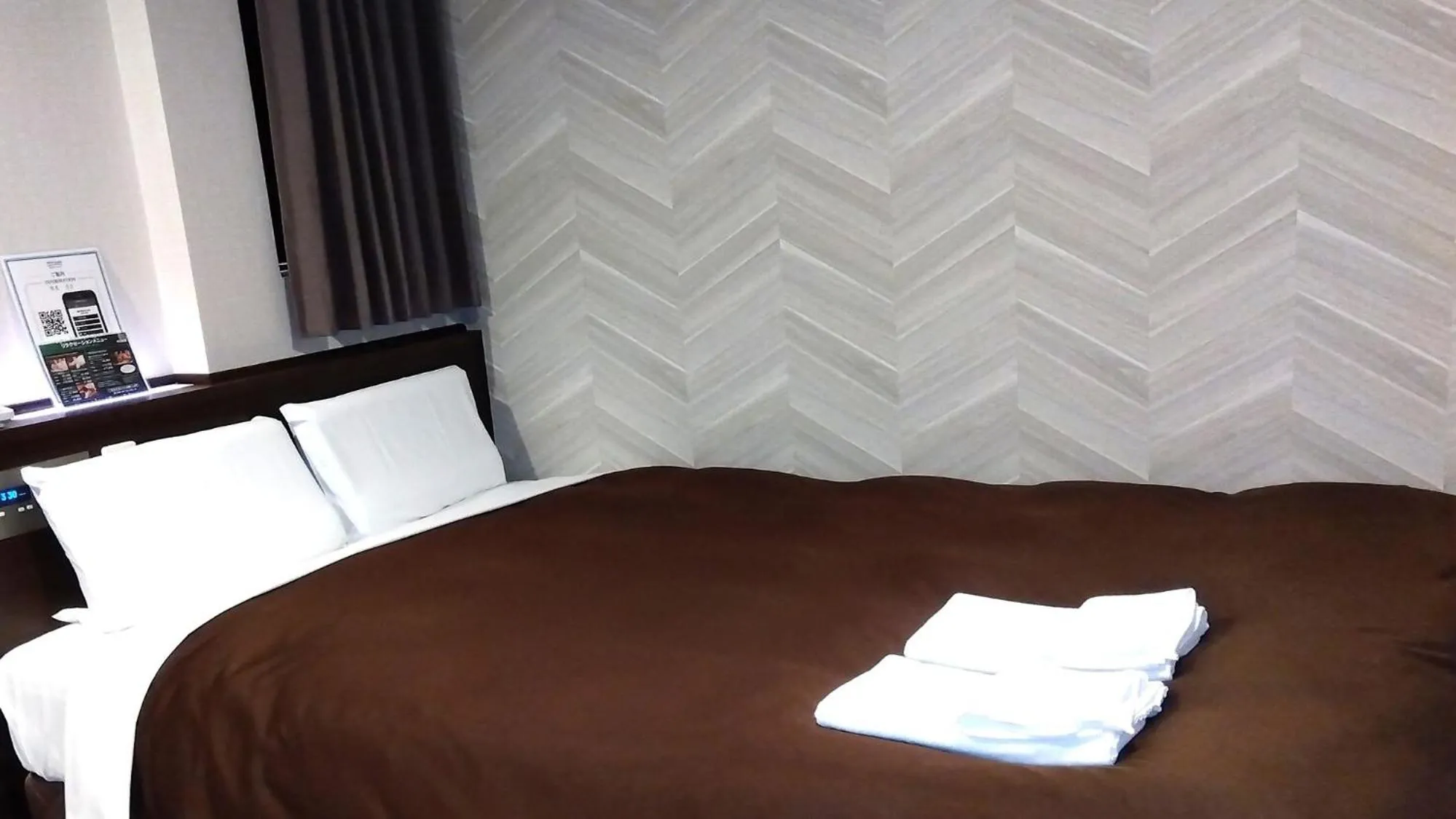 Bed in Hotel New Gaea Domemae