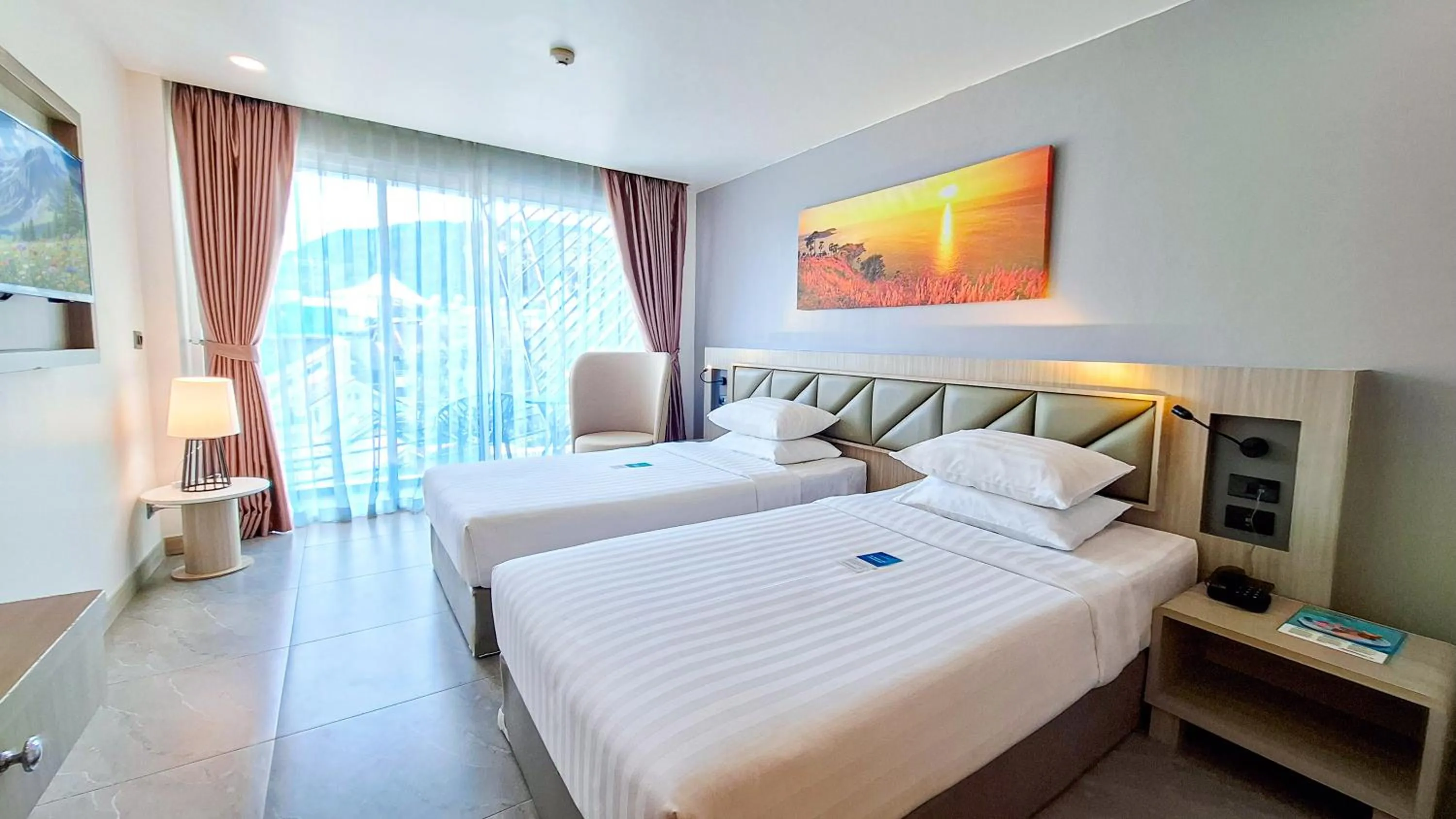 Bed in Clarian Hotel Beach Patong