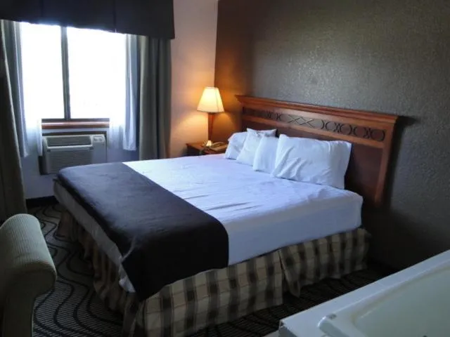 Bed in Oscoda Lakeside Hotel