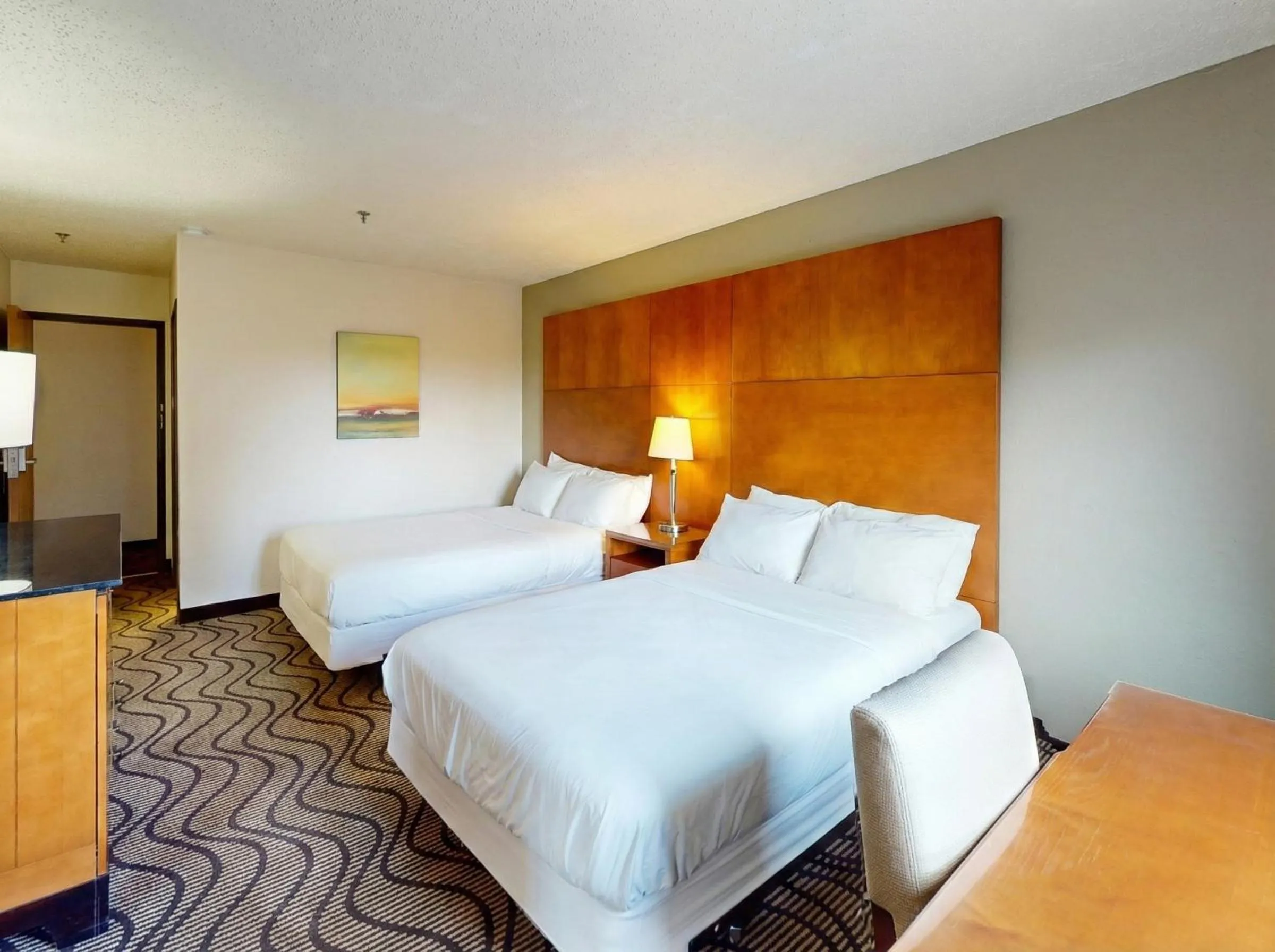 Bed in Oscoda Lakeside Hotel