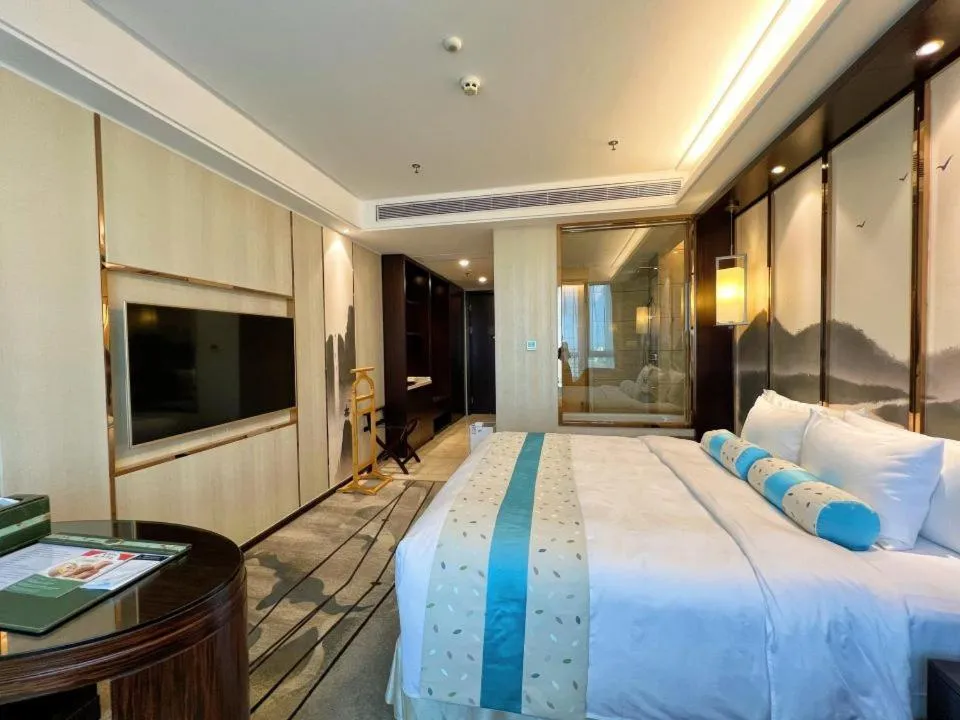 Bed in Menshine Gloria Plaza Hotel