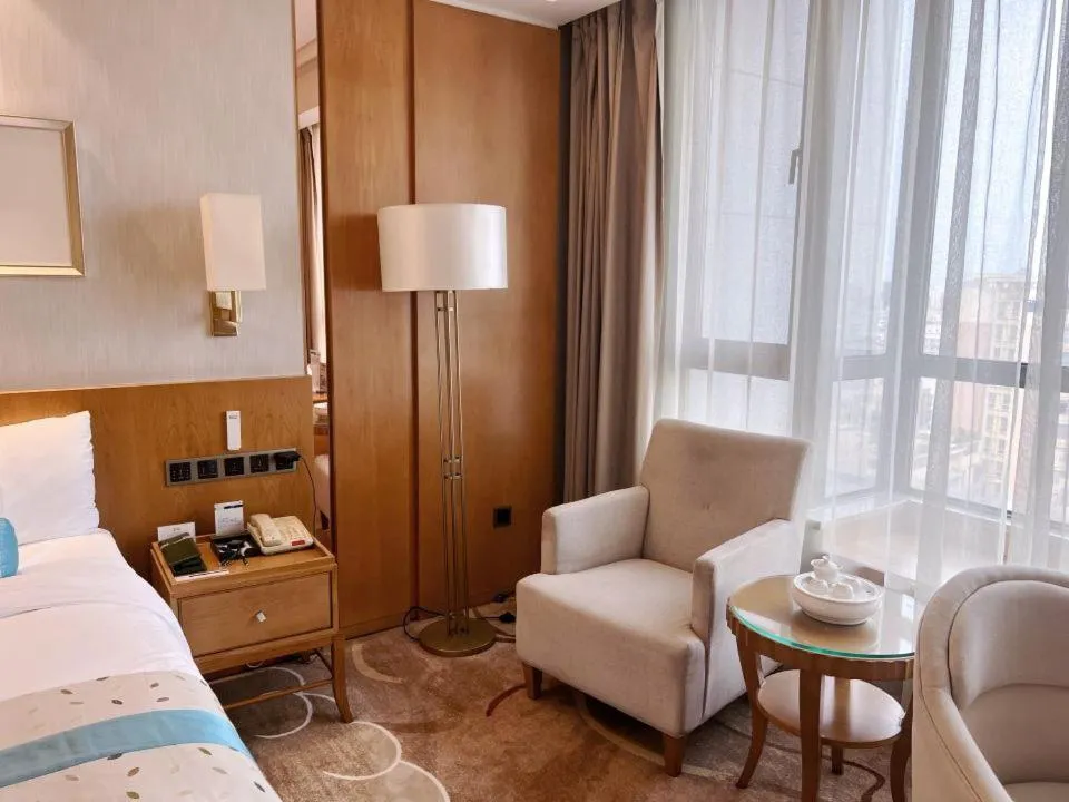 Bed in Menshine Gloria Plaza Hotel