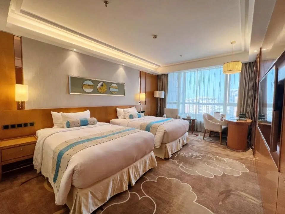 Bed in Menshine Gloria Plaza Hotel