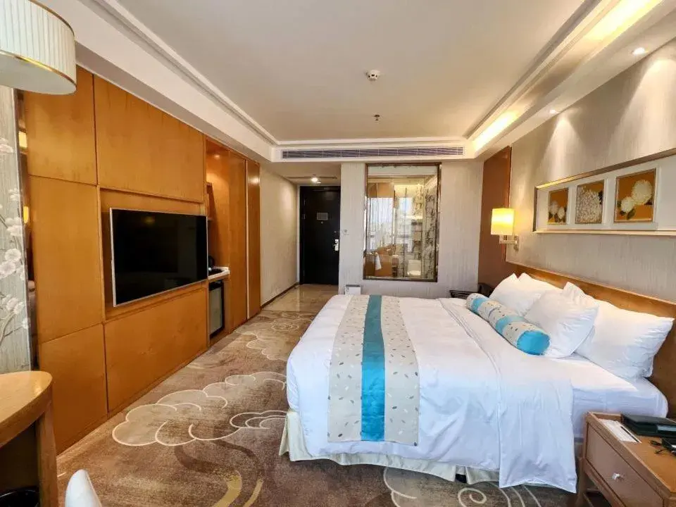 Bed in Menshine Gloria Plaza Hotel Bed in Menshine Gloria Plaza Hotel