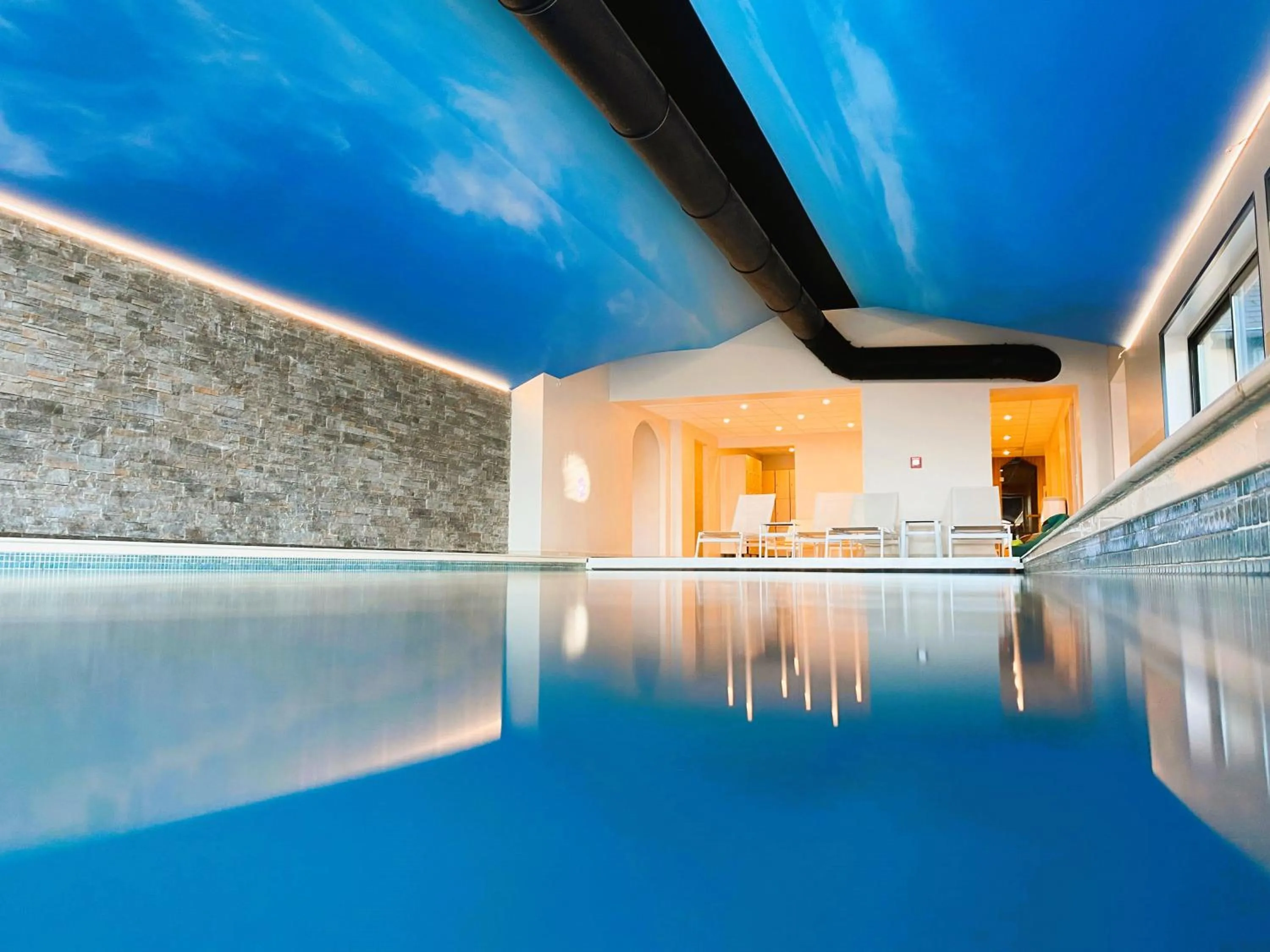 Swimming pool in Hôtel Antares & Spa