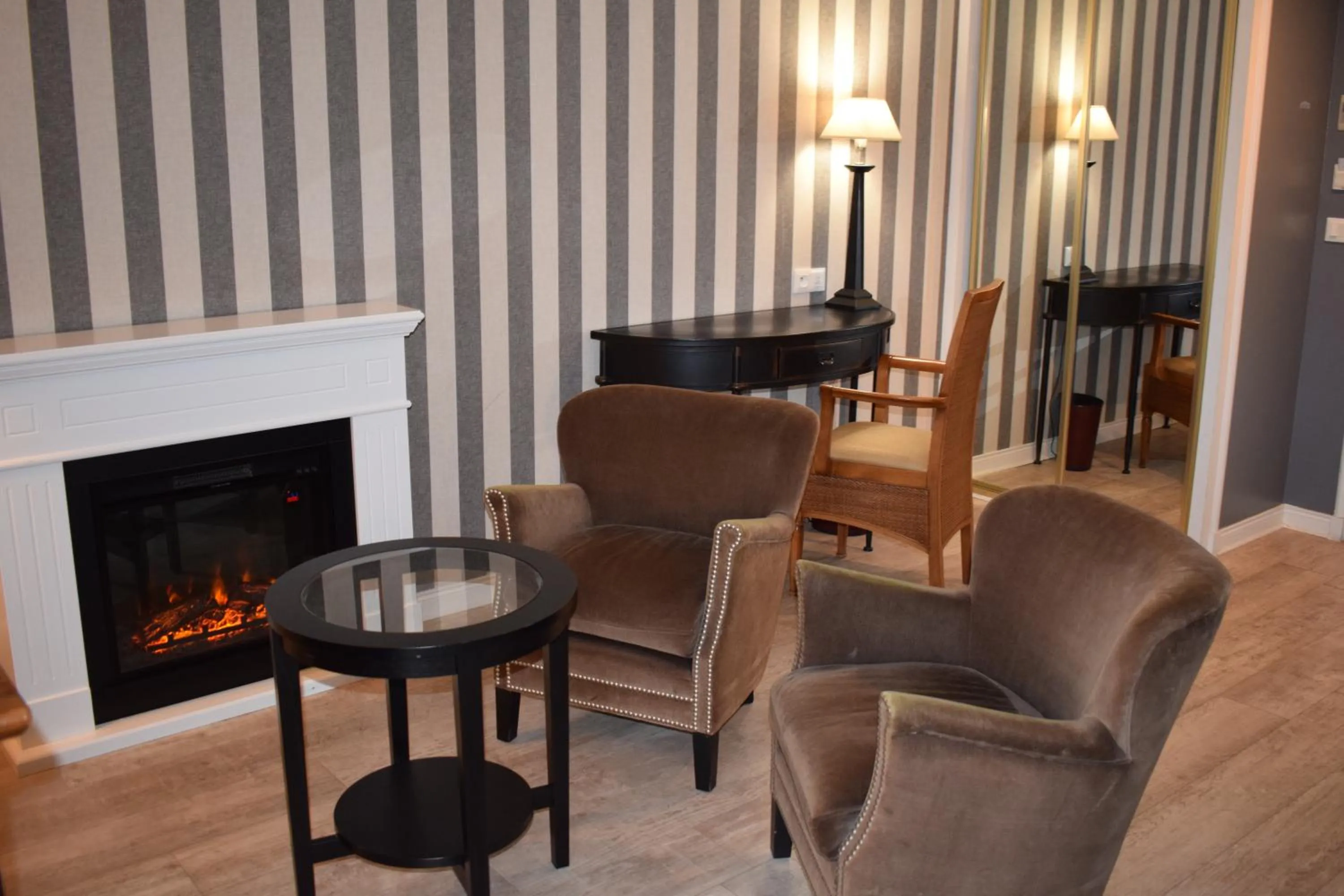 Living room in Le Trophée Boutique Hôtel Spa- La Loggia Appart'hôtel