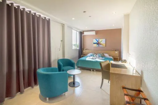 Bed in Q-Inn Boutique Hotel