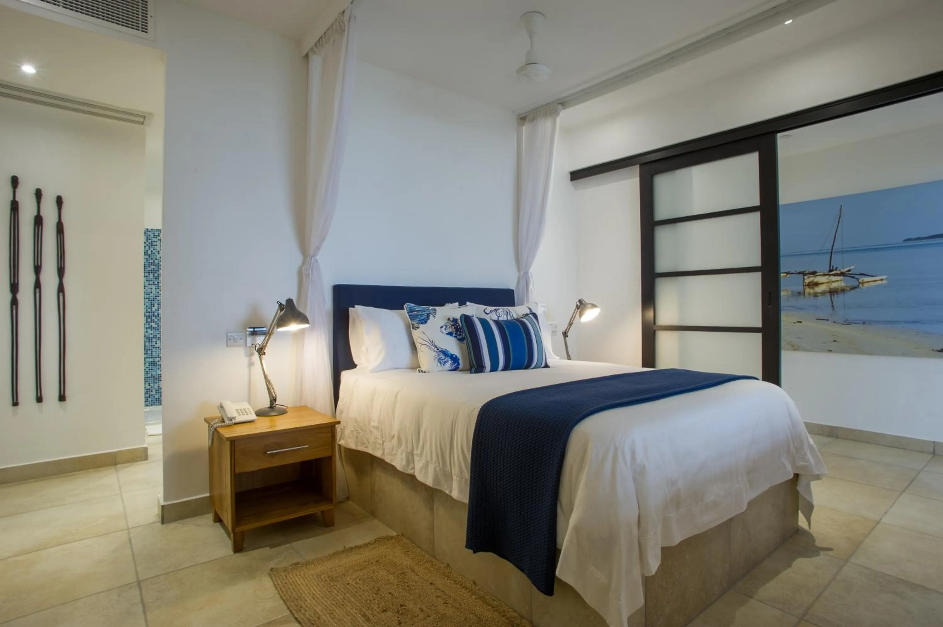 Bed in The Oyster Bay Hotel Suites