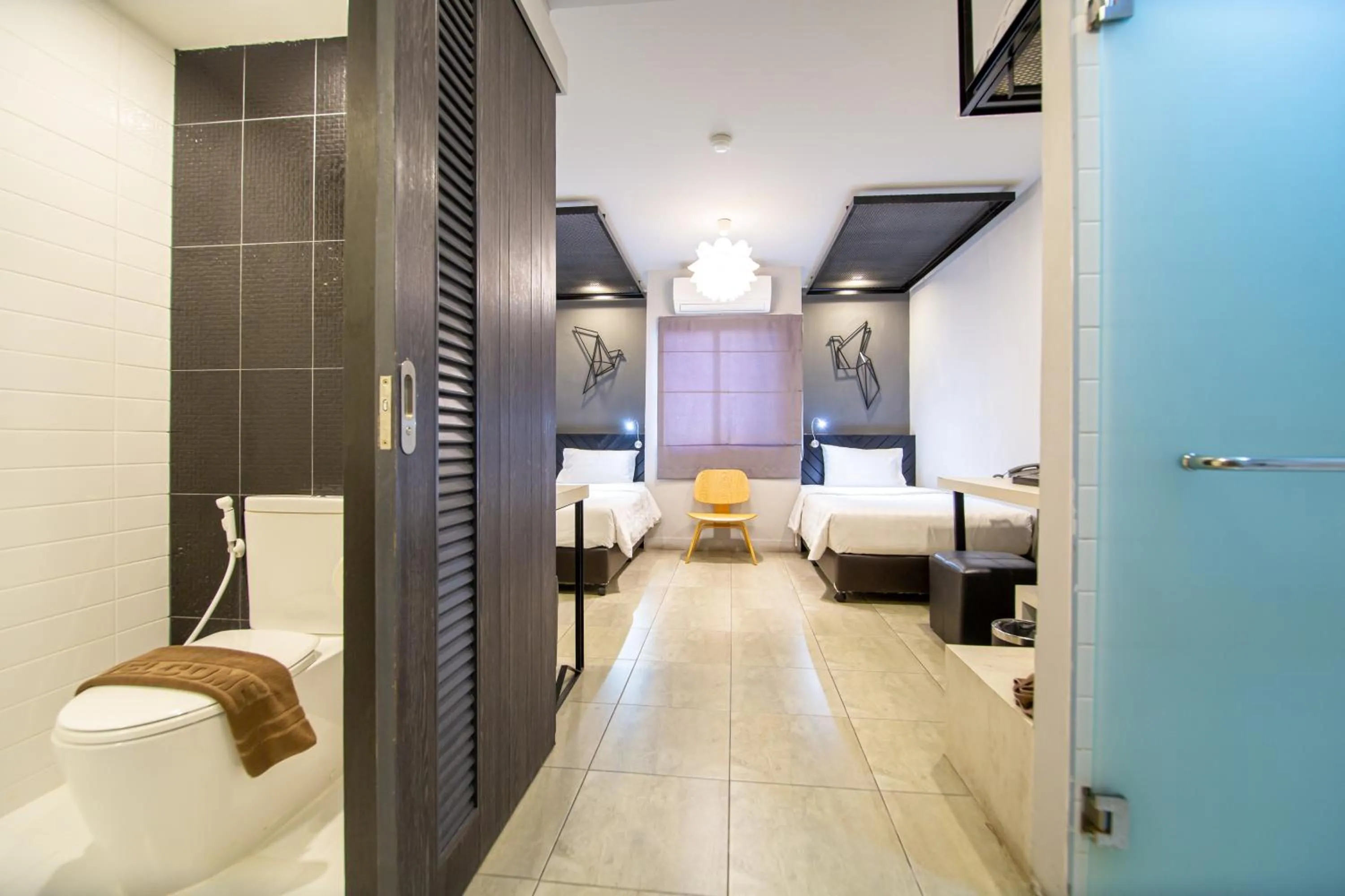 Photo of the whole room, Bed in WE Terminal Hotel