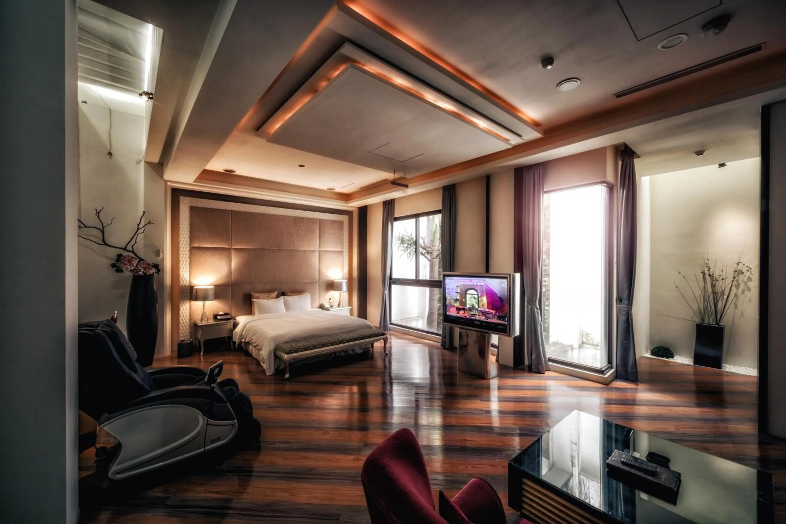 Communal lounge/ TV room, Bed in Bali Motel - Zhongli