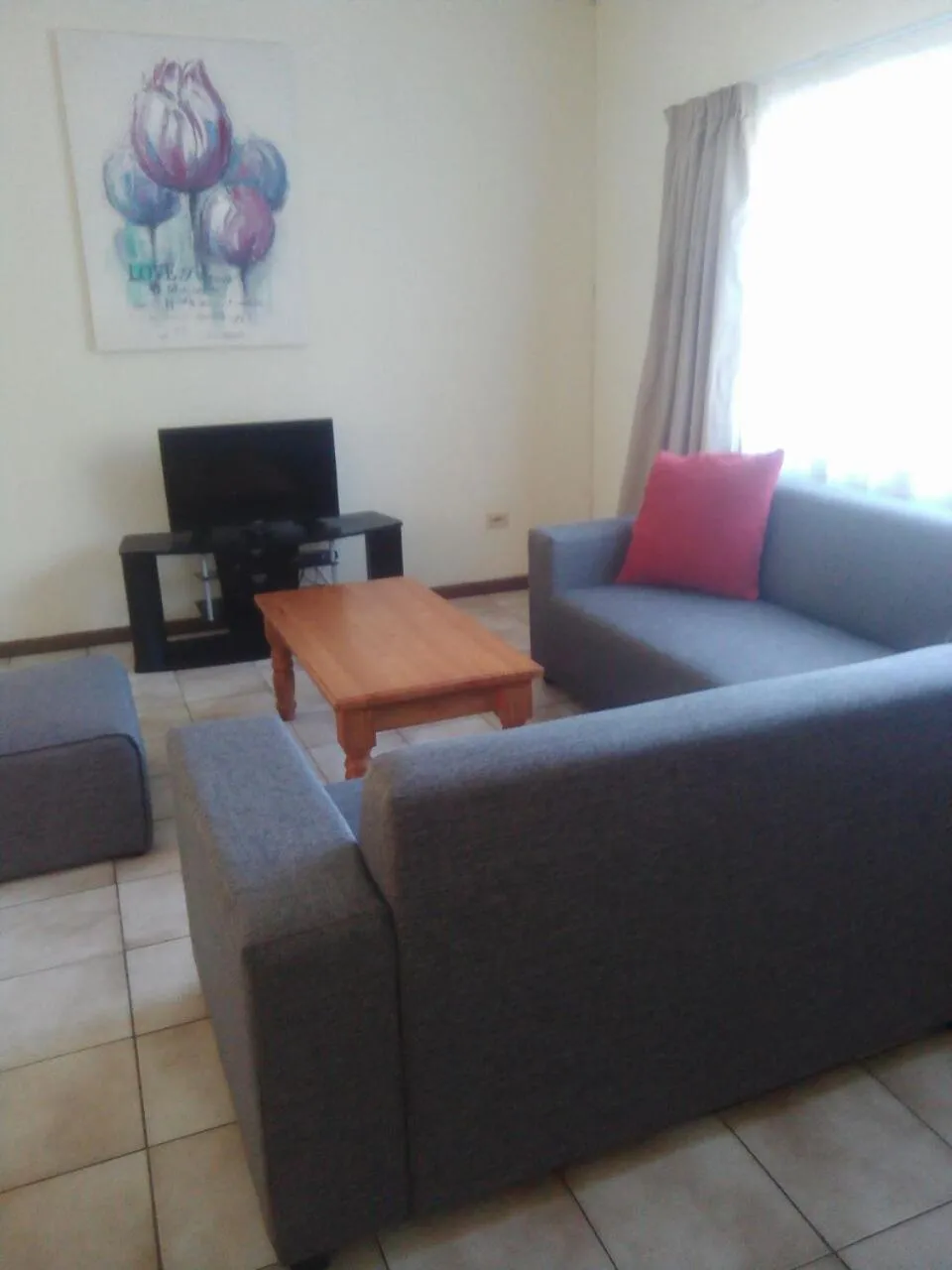 Communal lounge/ TV room in Doonside Holiday Apartments