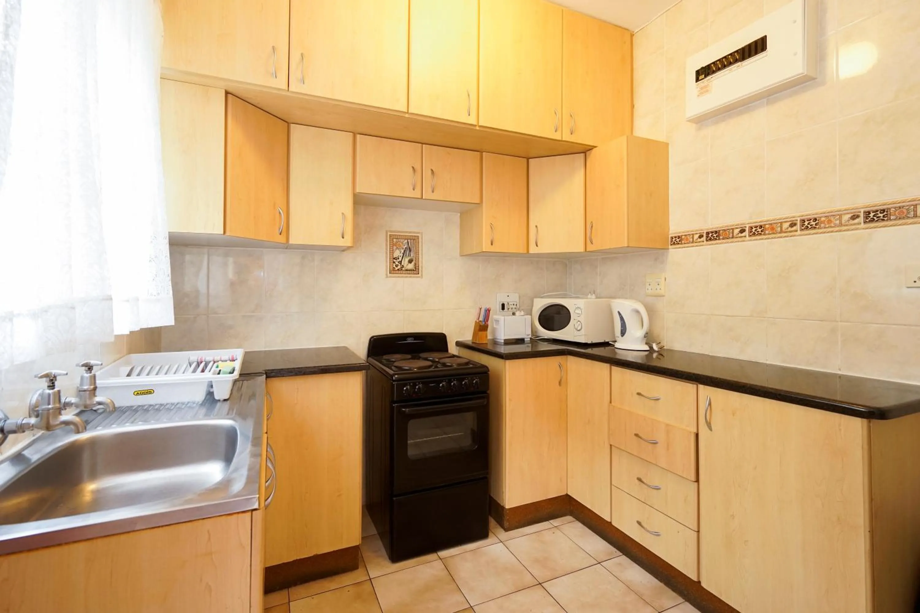 Kitchen or kitchenette in Doonside Holiday Apartments