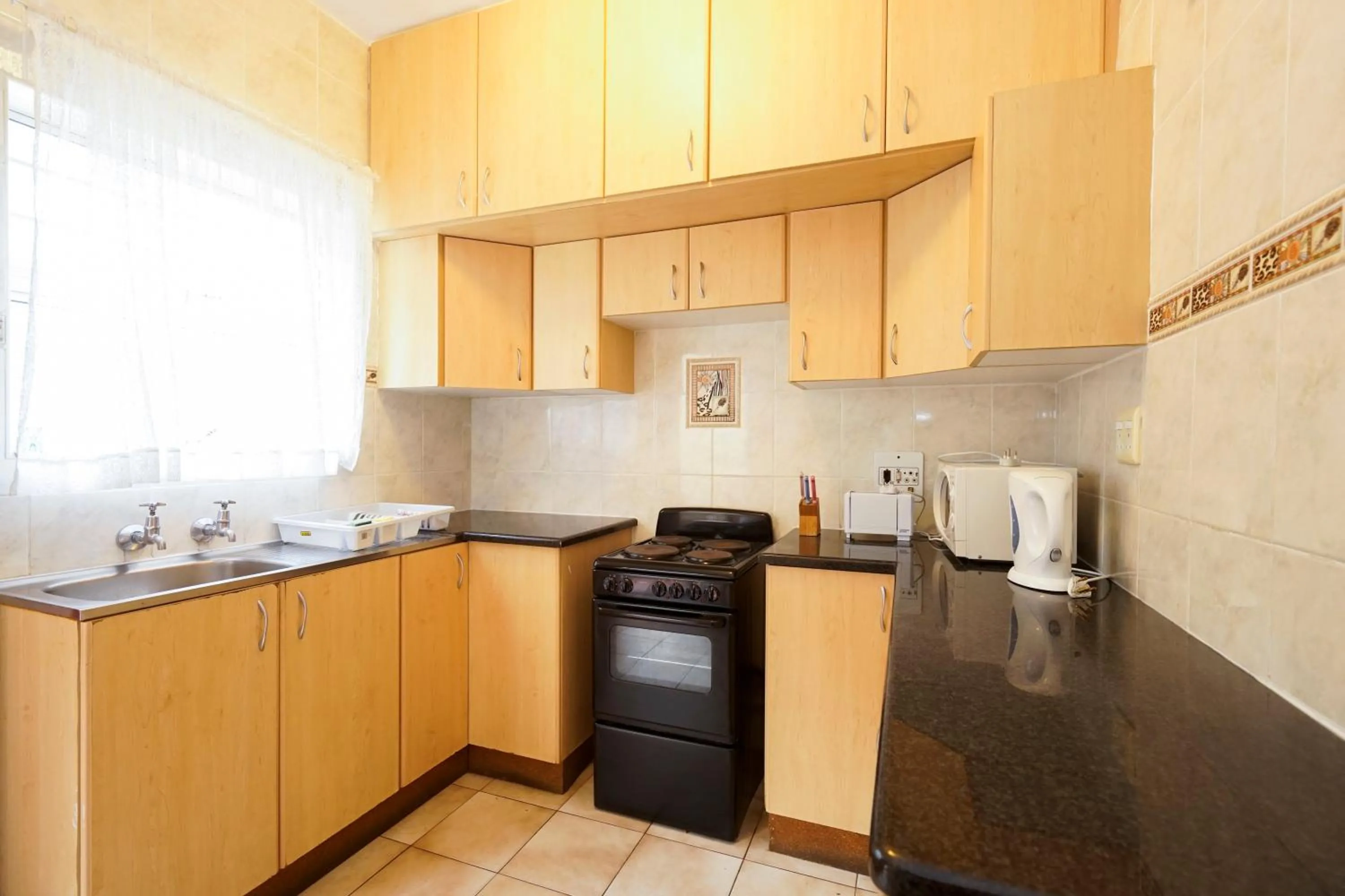 Kitchen or kitchenette in Doonside Holiday Apartments